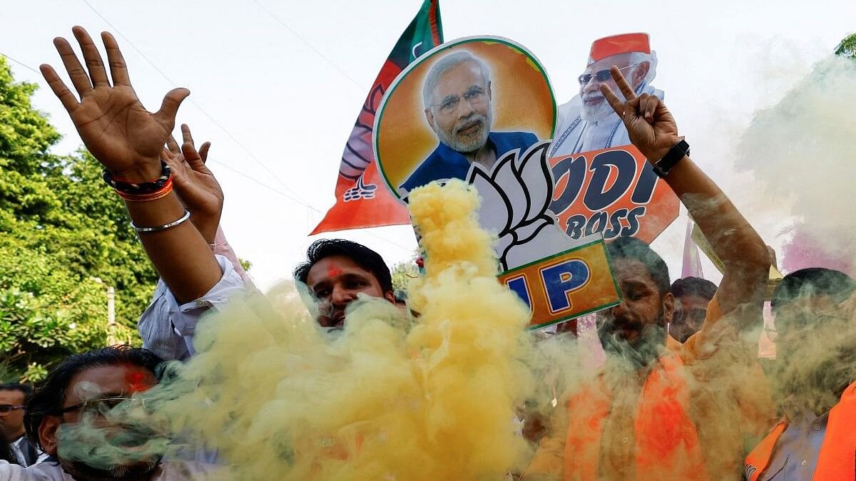 <div class="paragraphs"><p>BJP supporters celeberate.</p></div>