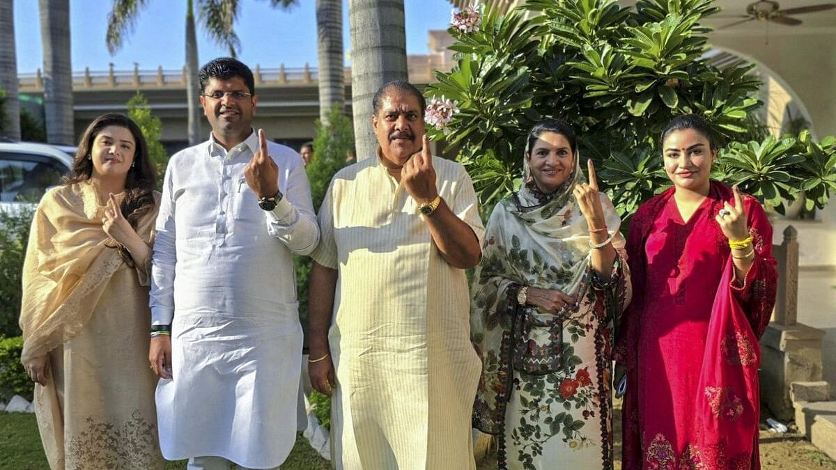 <div class="paragraphs"><p>File photo of Jannayak Janta Party (JJP) leader Dushyant Chautala and his family members.</p></div>