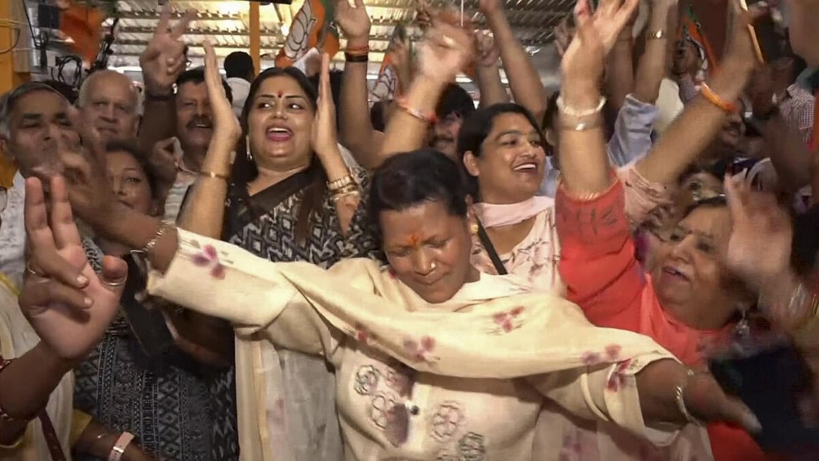 <div class="paragraphs"><p>BJP workers celebrate as the party leads during the counting of votes of Haryana Assembly elections, in Ambala district, Haryana, Tuesday, October 8, 2024.</p></div>