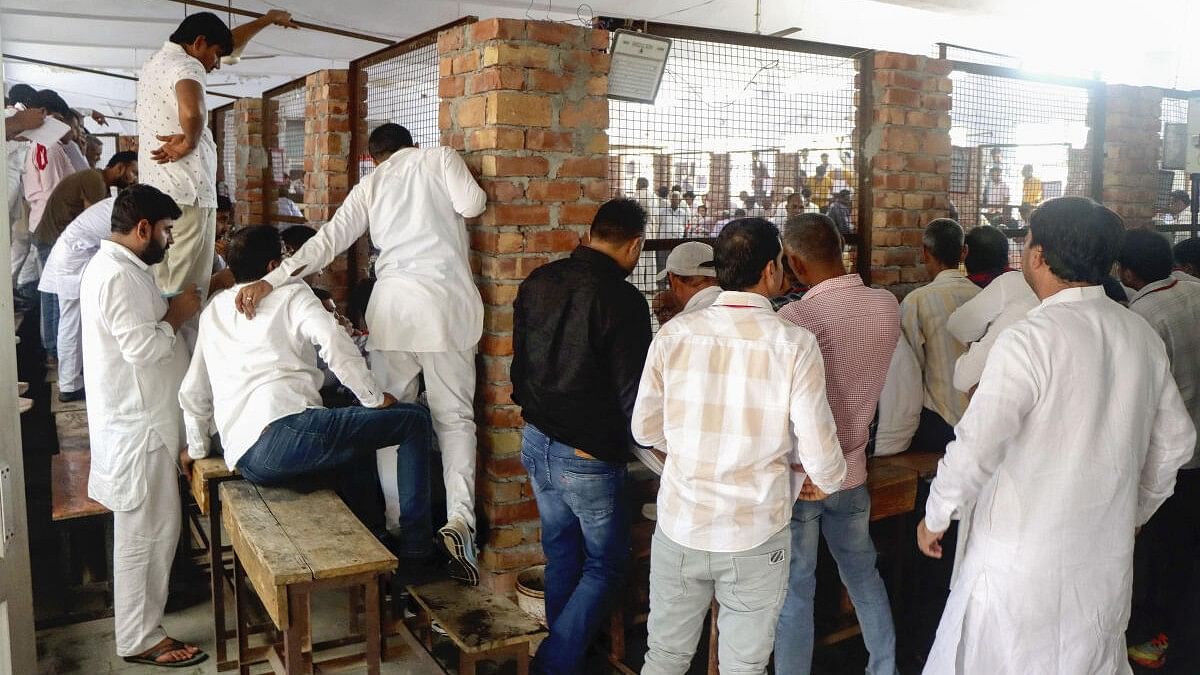 <div class="paragraphs"><p>Poll agents during counting of votes for Haryana Assembly polls, in Rohtak, Tuesday, October 8, 2024.</p></div>