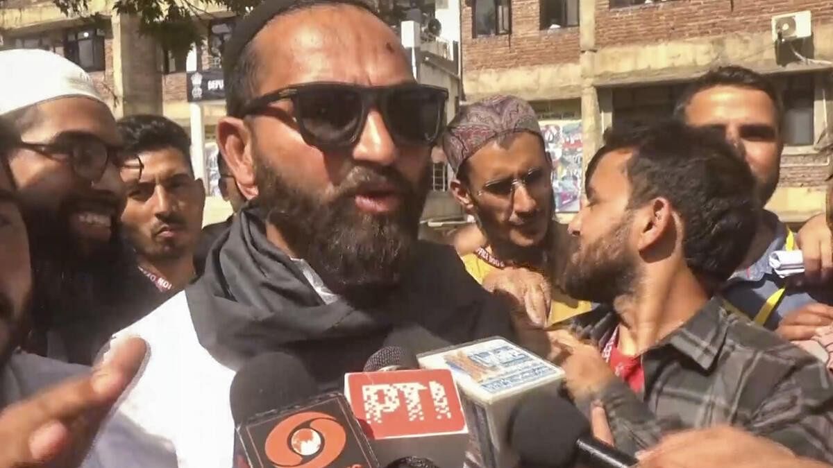 <div class="paragraphs"><p>AAP candidate Mehraj Malik talks to the media after he won from Doda Assembly seat, in Doda.</p></div>