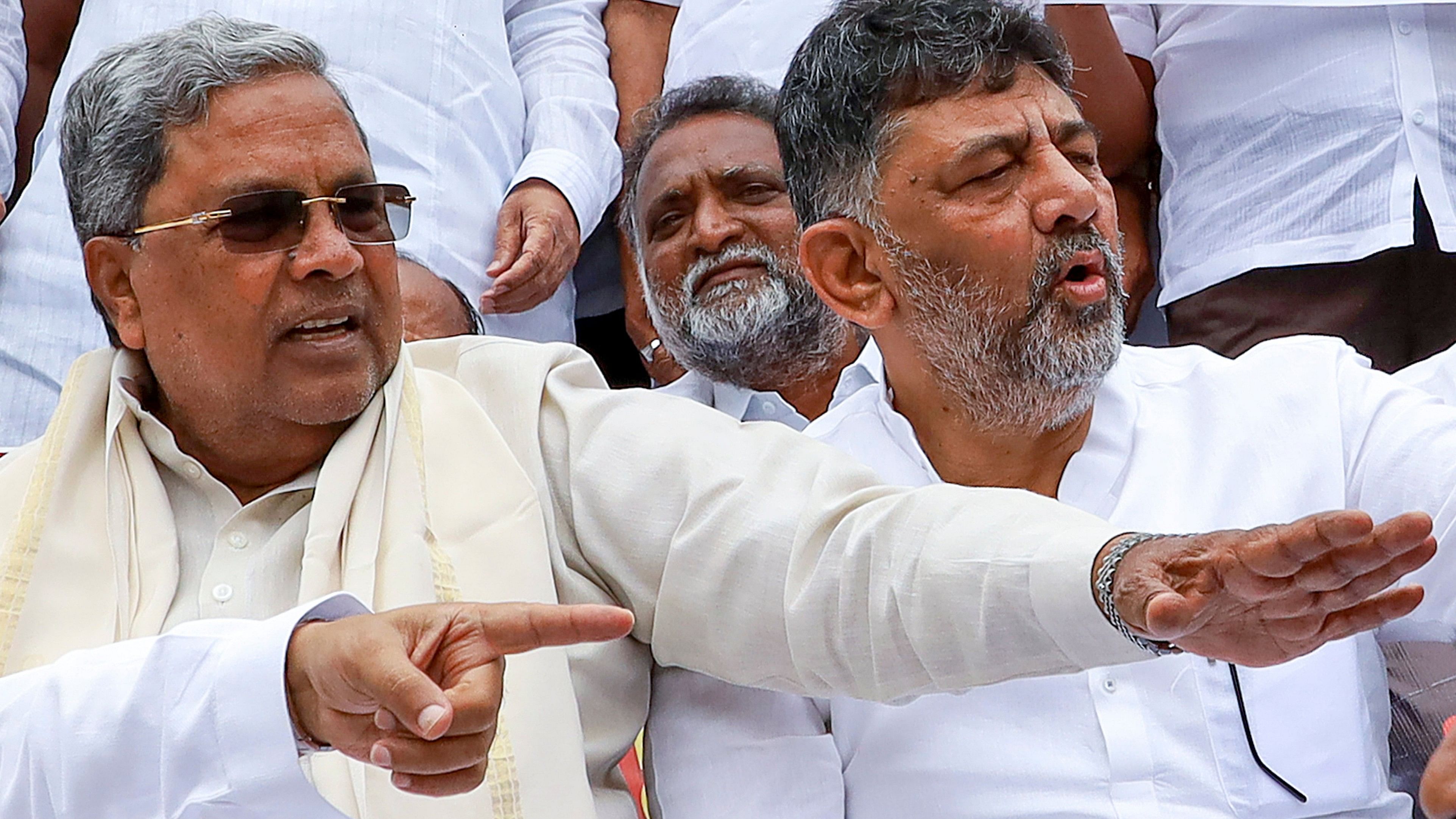 <div class="paragraphs"><p>Karnataka Chief Minister Siddaramaiah and Deputy CM D K Shivakumar along with other Congress leaders stage a protest against the central government over the sanction granted by Governor Thaawarchand Gehlot to investigate and prosecute Siddaramaiah in the alleged Mysuru Urban Development Authority (MUDA) site allotment scam, in Bengaluru, Saturday, Aug 31, 2024. </p></div>