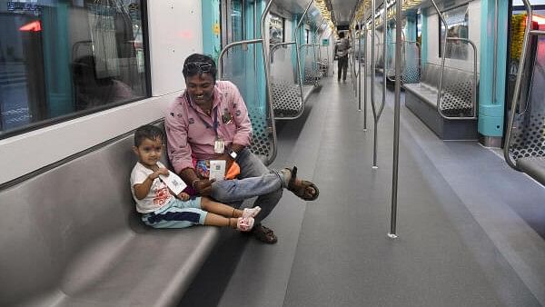 <div class="paragraphs"><p>People ride a metro on the Bandra Kurla Complex (BKC) to Aarey underground section of Mumbai Metro Line 3 after it was opened for public, in Mumbai</p></div>