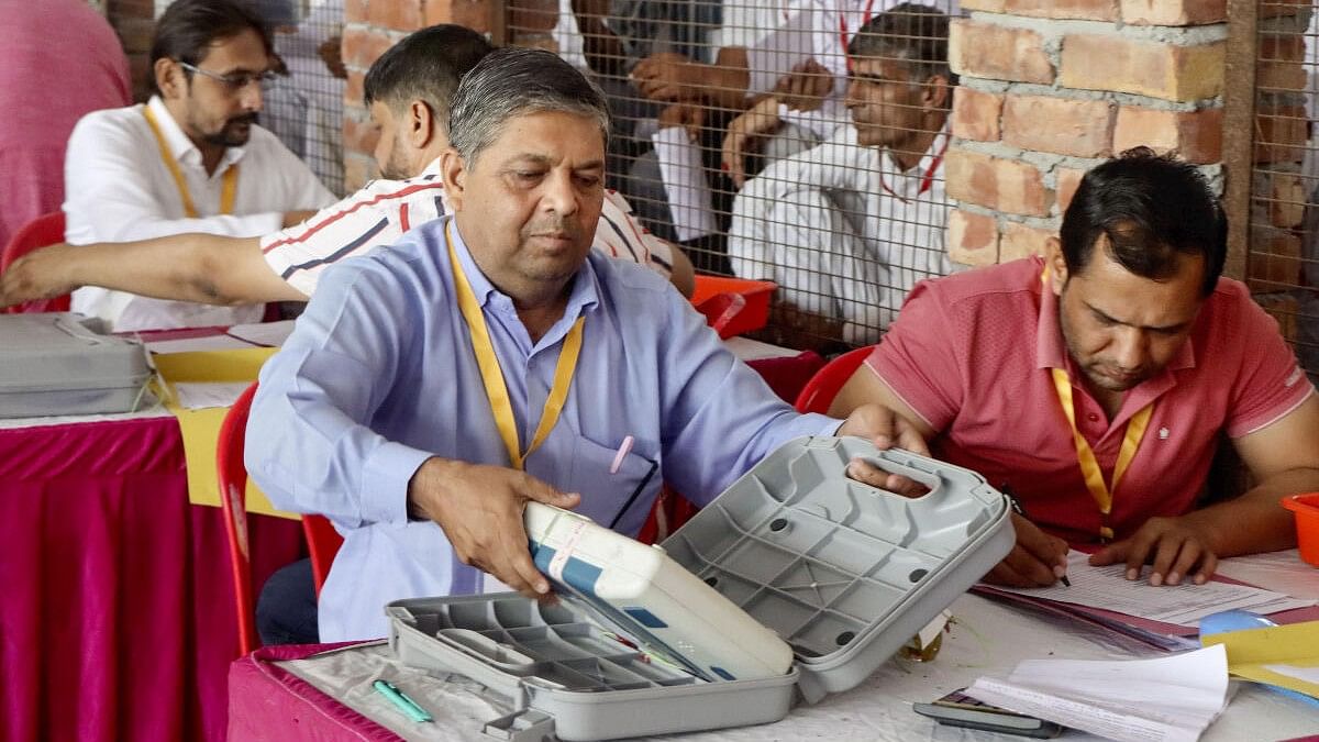 <div class="paragraphs"><p>Election officials count votes for the Haryana Assembly elections, at a counting center, in Rohtak, Tuesday, October 8, 2024. </p></div>