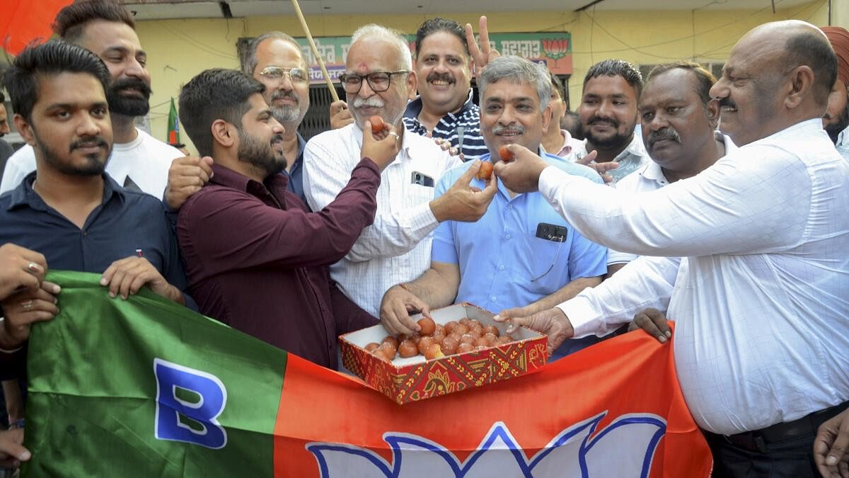 <div class="paragraphs"><p>BJP supporters celebrate party’s victory in Haryana Assembly elections outside the party office on Tuesday.&nbsp;</p></div>