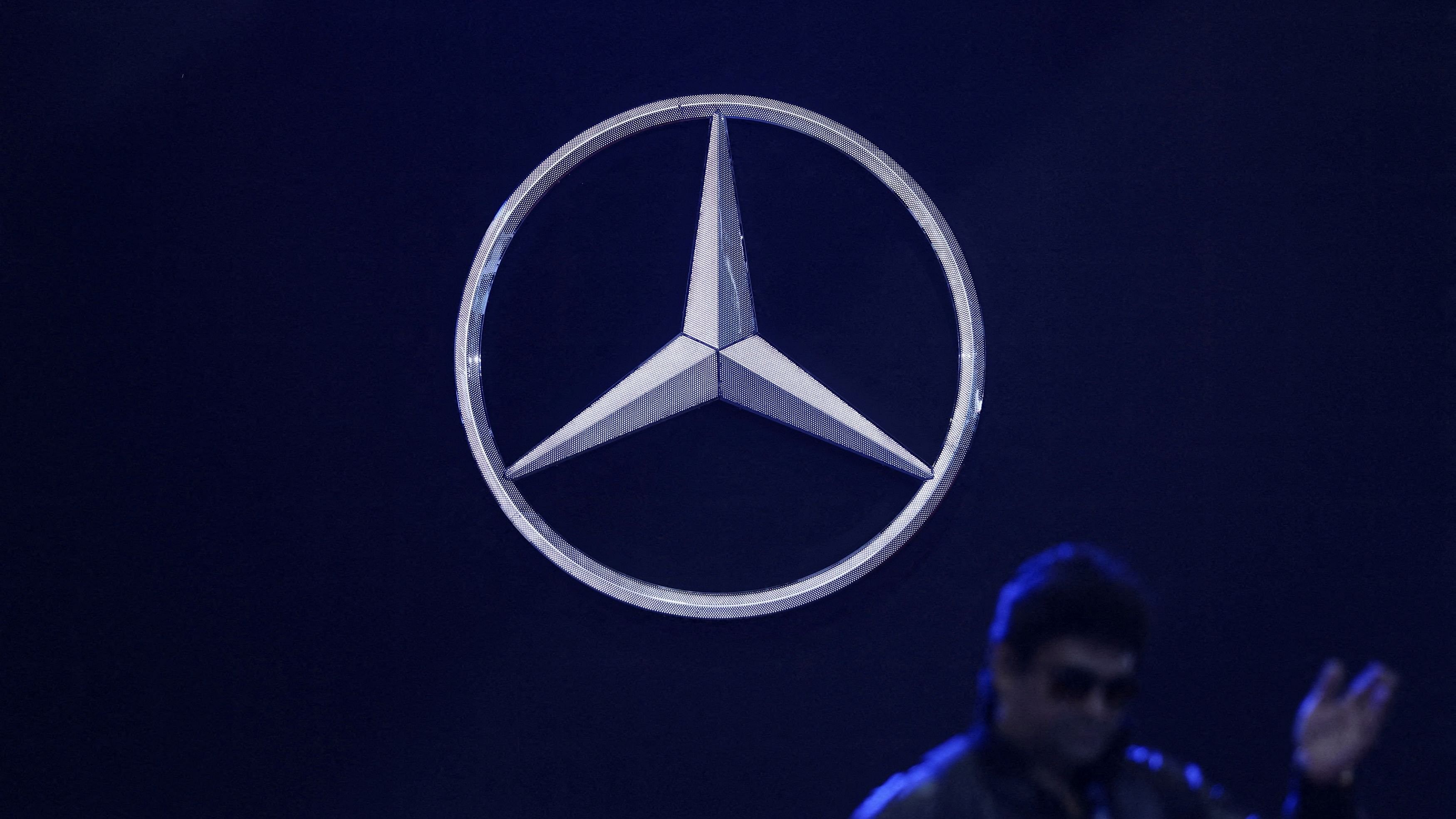 <div class="paragraphs"><p>A man walks past the logo of Mercedes-Benz at Bharat Mobility Global Expo organised by India's commerce ministry at Pragati Maidan in New Delhi.&nbsp;</p></div>