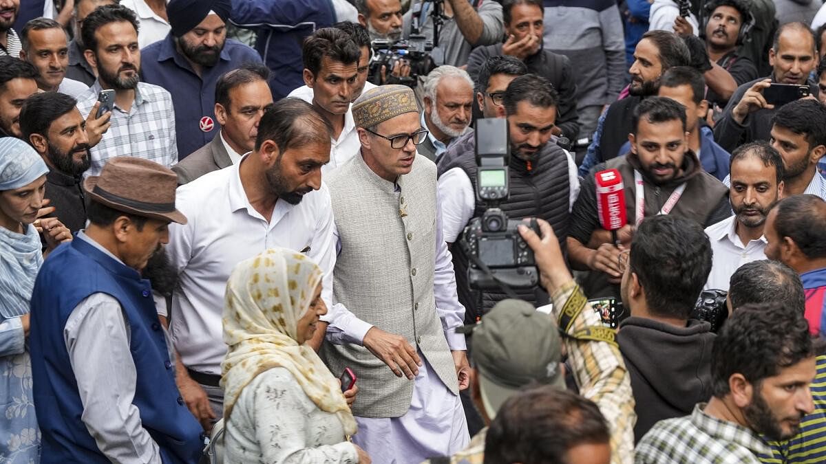 <div class="paragraphs"><p>Jammu and Kashmir National Conference Vice President Omar Abdullah being greeted by supporters after winning the Jammu and Kashmir Assembly elections from Budgam and Ganderbal constituencies, in Srinagar, Tuesday, Oct. 8, 2024.</p></div>