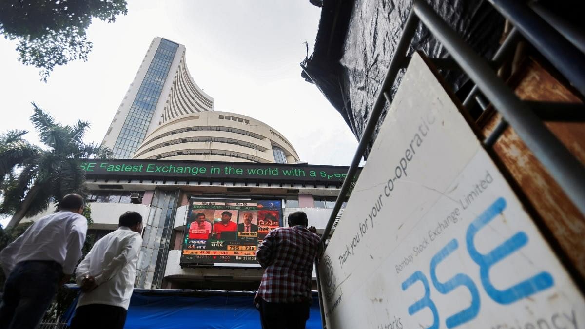 <div class="paragraphs"><p>People stand outside the Bombay Stock Exchange (BSE)</p></div>