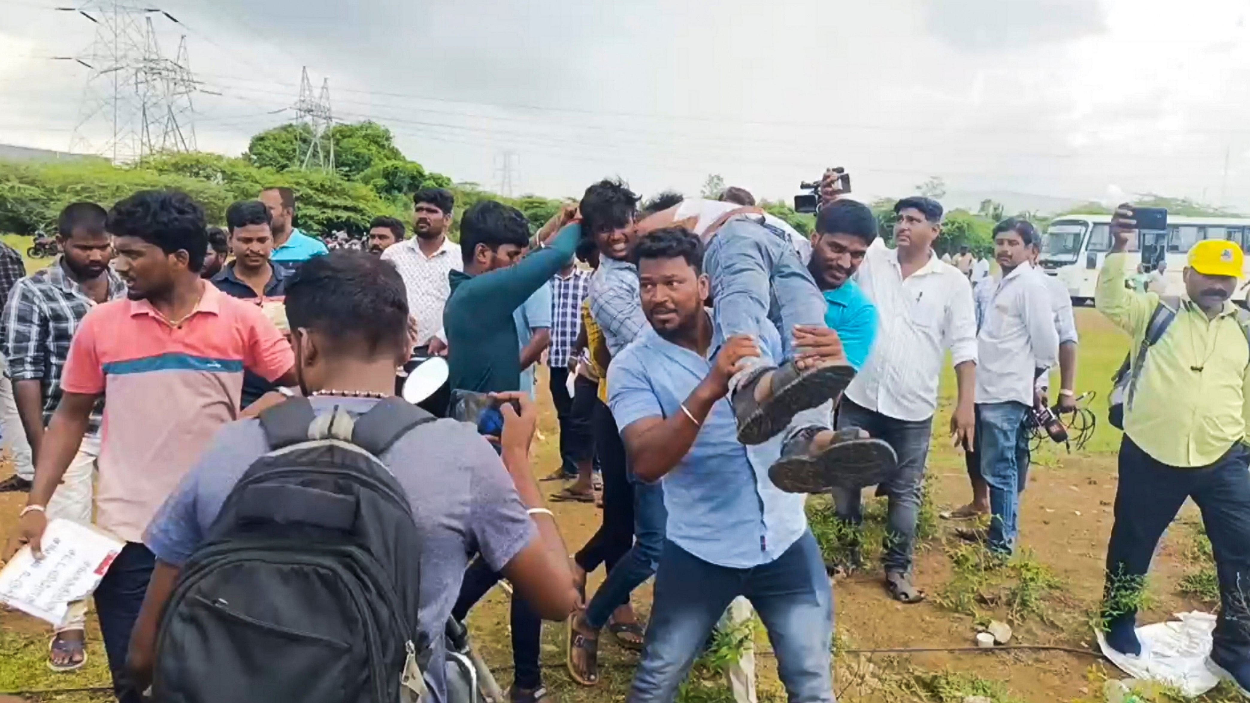 <div class="paragraphs"><p> Workers of the Samsung India Electronics factory take a fellow worker for medical assistance during their strike at Sriperumbudur, in Kancheepuram district, Tamil Nadu, Wednesday, Oct. 9, 2024.  </p></div>