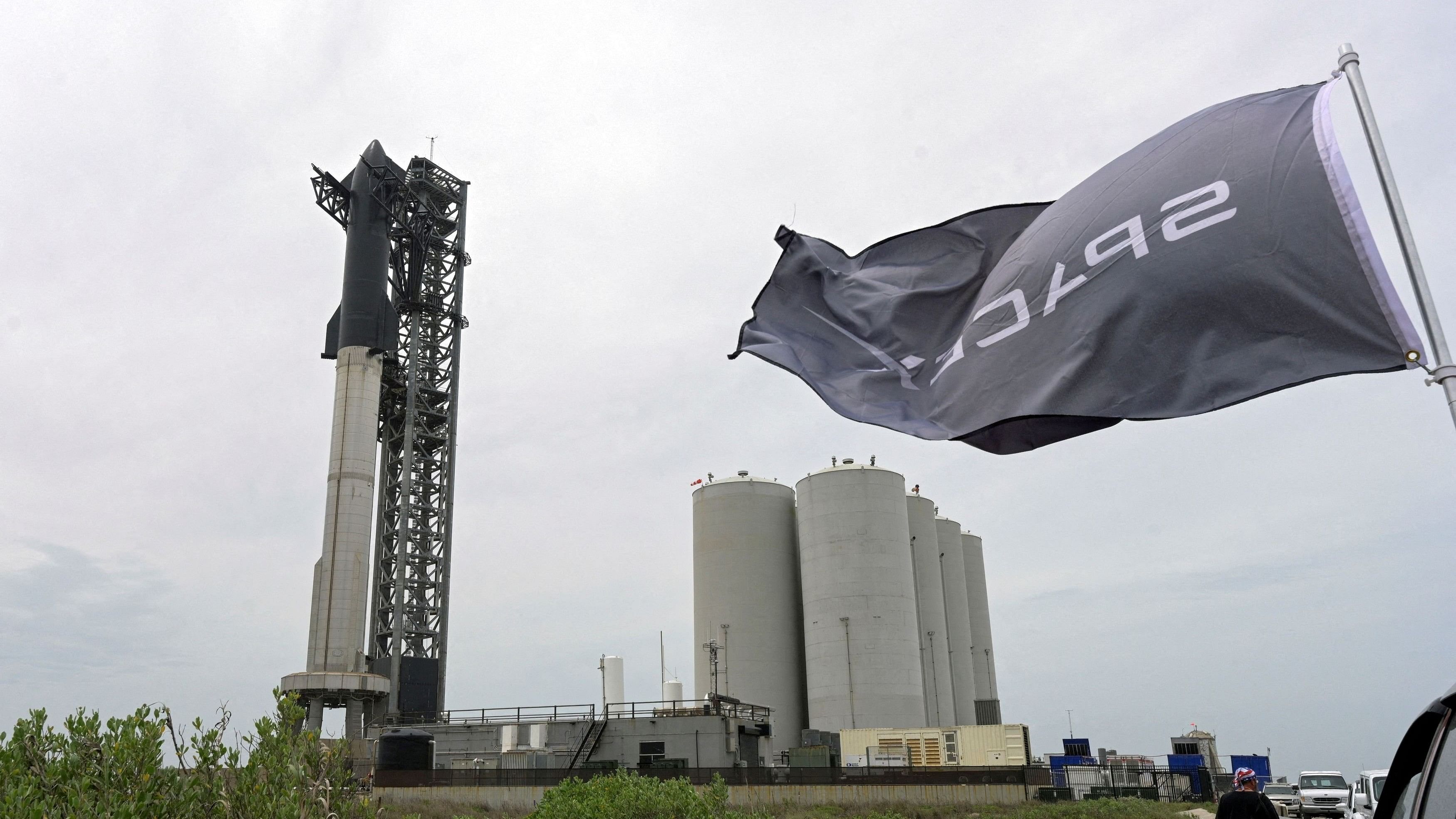 <div class="paragraphs"><p>The SpaceX Starship is seen on its Boca Chica launchpad as a SpaceX flag flies from a parked car. Representative image.</p></div>