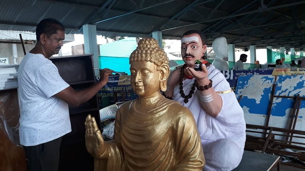 <div class="paragraphs"><p>Artiste K R Gopal gives final touch to statues of Buddha and Basavanna, for a tableau of the Social Welfare department in Mysuru.</p></div>