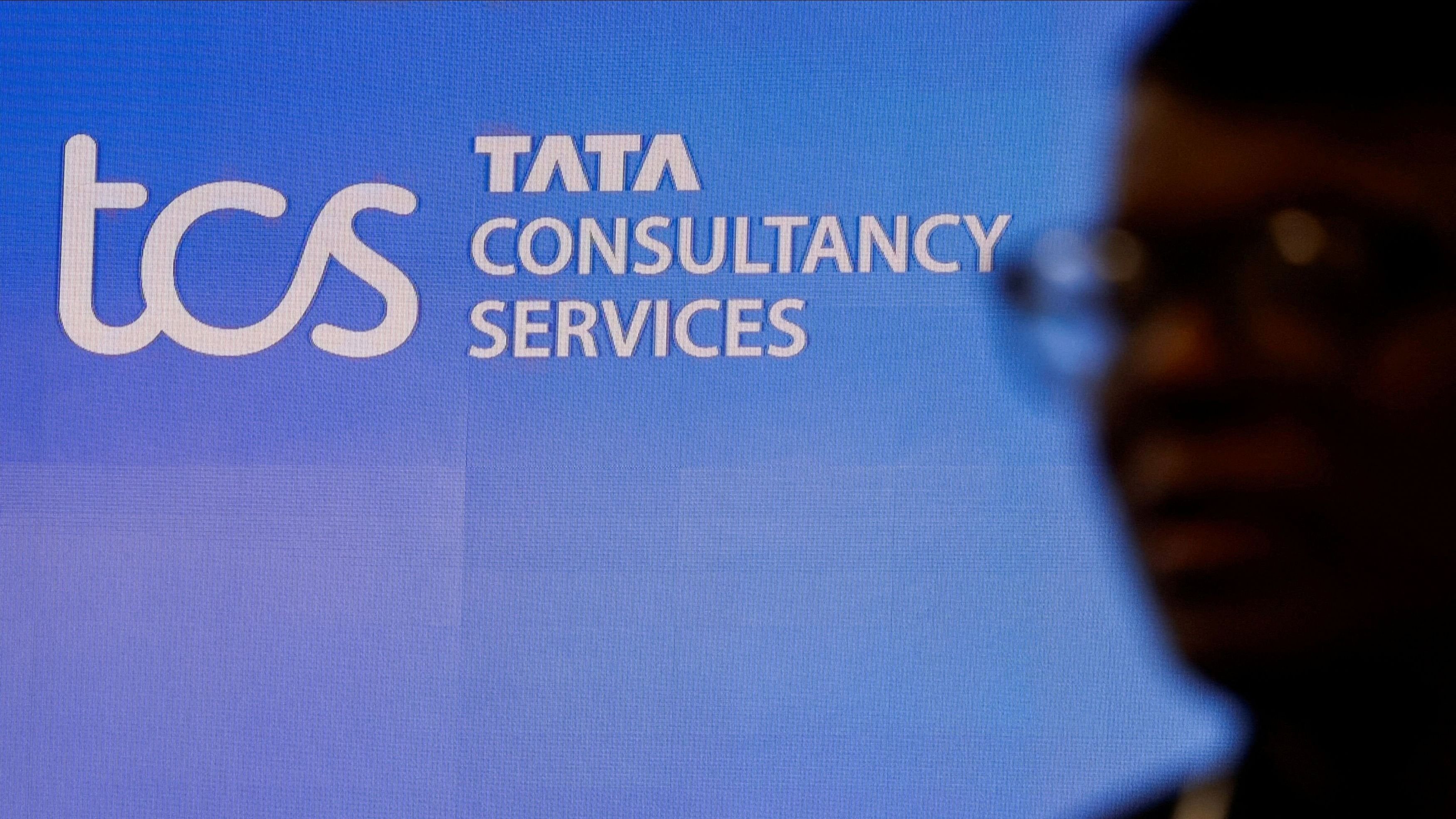 <div class="paragraphs"><p>FILE PHOTO: A man walks past a logo of Tata Consultancy Services  before a press conference announcing the company's quarterly results in Mumbai, India.&nbsp;</p></div>