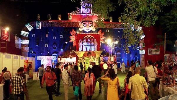 <div class="paragraphs"><p>Visitors at a community puja pandal. Representative image.</p></div>