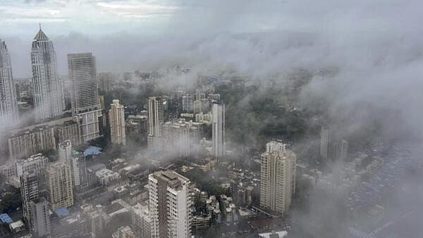 <div class="paragraphs"><p>Top angle view of dense clouds shrouding the city of Mumbai</p></div>