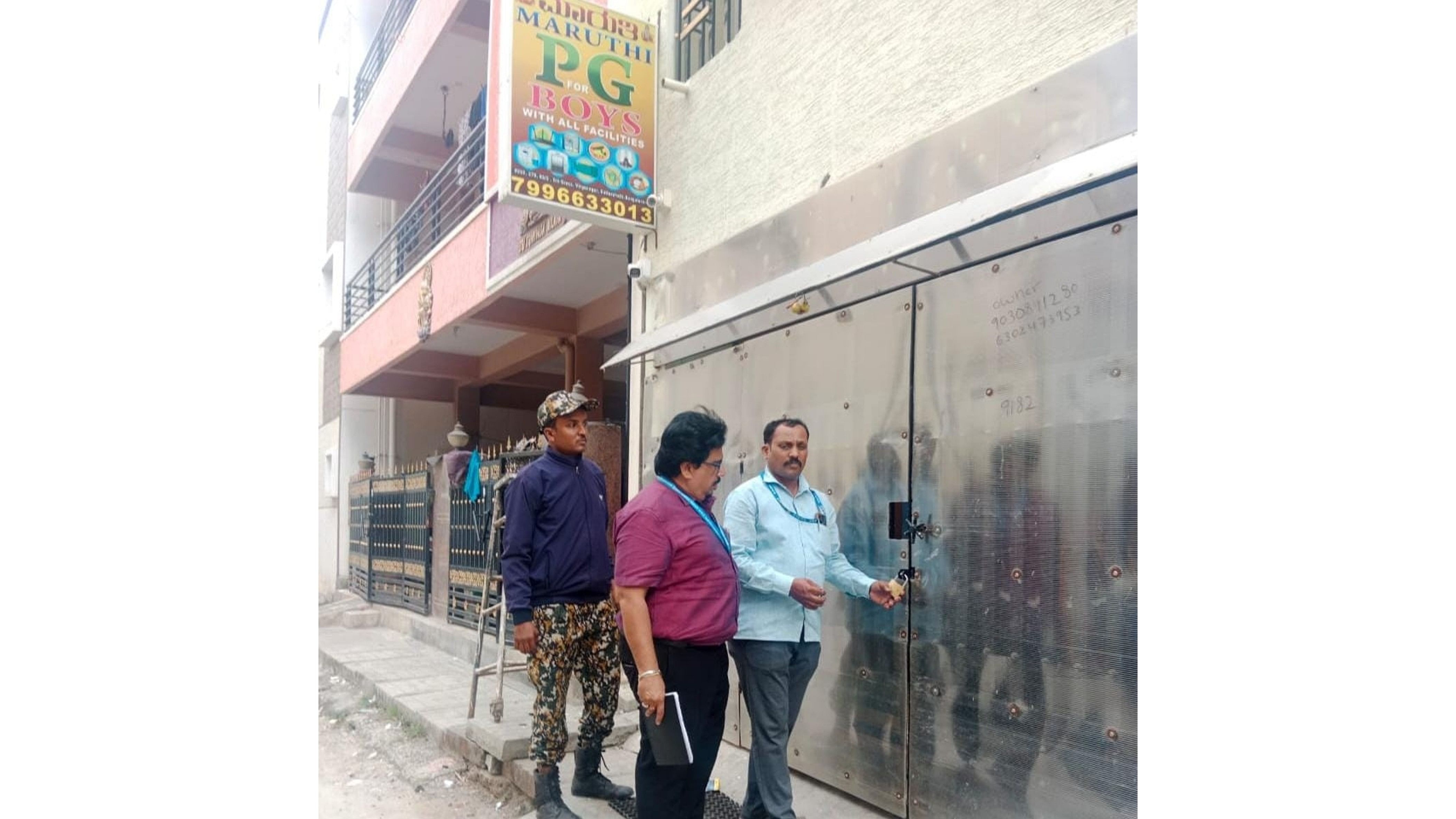 <div class="paragraphs"><p>Civic officials&nbsp;seal an unauthorised/illegal paying guest accommodation in the city on Thursday. </p></div>