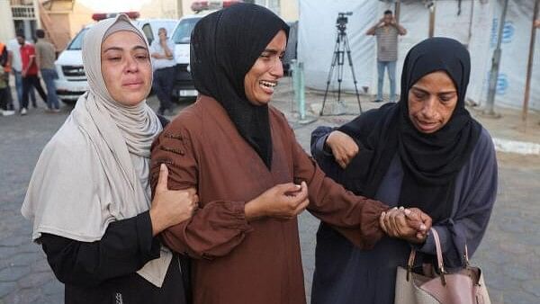 <div class="paragraphs"><p>Mourners react near the bodies of Palestinians, who were killed in an Israeli strike, amid the Israel-Hamas conflict, at Al-Aqsa Martyrs Hospital in Deir Al-Balah in the central Gaza Strip, October 9, 2024.</p></div>