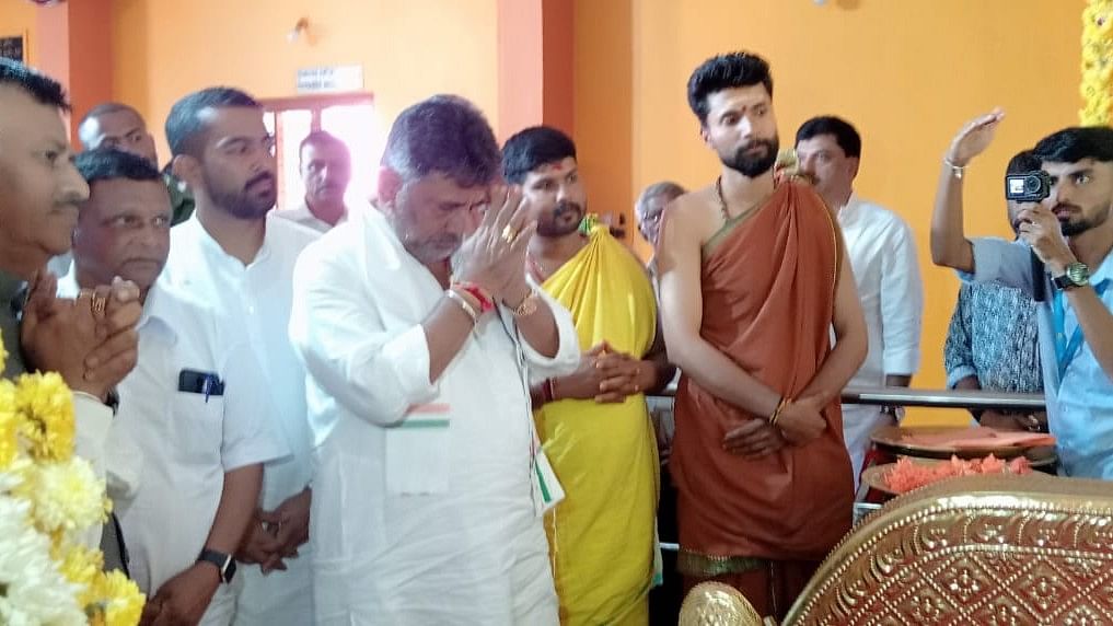 <div class="paragraphs"><p>Karnataka Deputy Chief Minister D K Shivakumar offering prayers in a temple at Madikeri. </p></div>