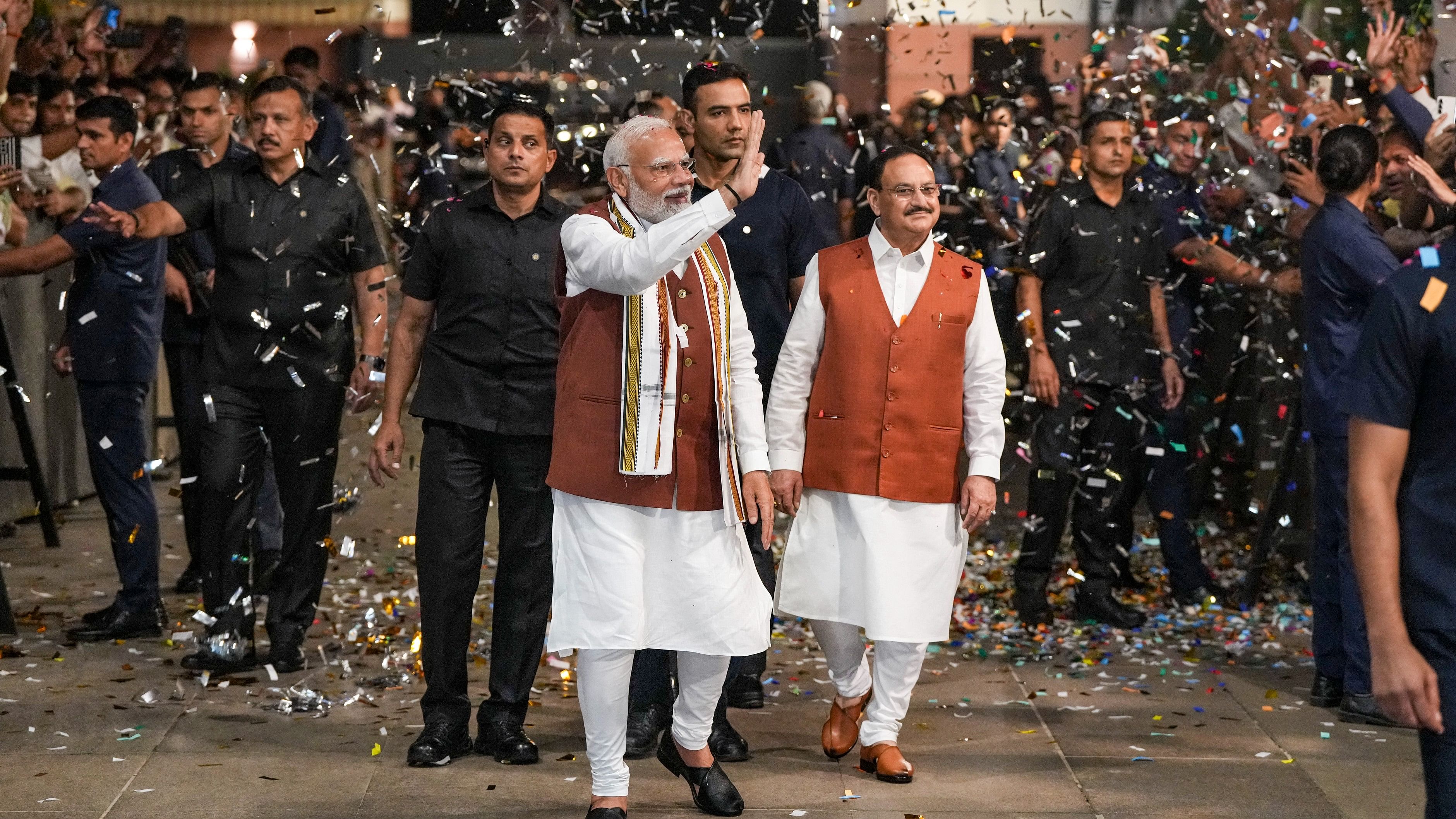 <div class="paragraphs"><p>Prime Minister Narendra Modi greets the gathering upon his arrival at the party headquarters during an event after the declaration of results for the Haryana and Jammu and Kashmir Assembly elections, in New Delhi, Tuesday, Oct. 8, 2024.</p></div>