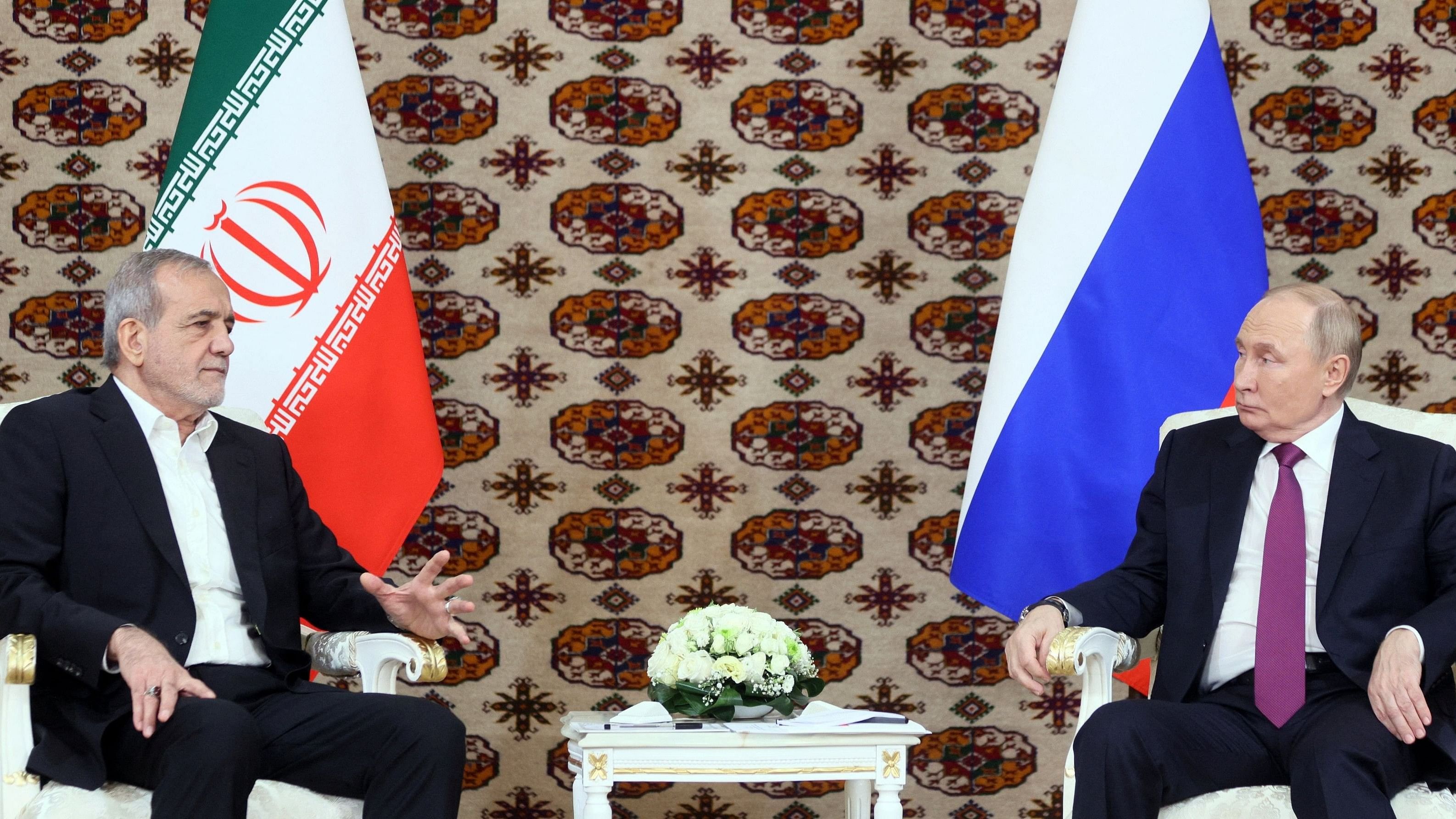 <div class="paragraphs"><p>Russian President Vladimir Putin meets Iranian counterpart Masoud Pezeshkian on the sidelines of a cultural forum dedicated to the 300th anniversary of the birth of the Turkmen poet and philosopher Magtymguly Fragi, in Ashgabat, Turkmenistan October 11, 2024.   </p></div>