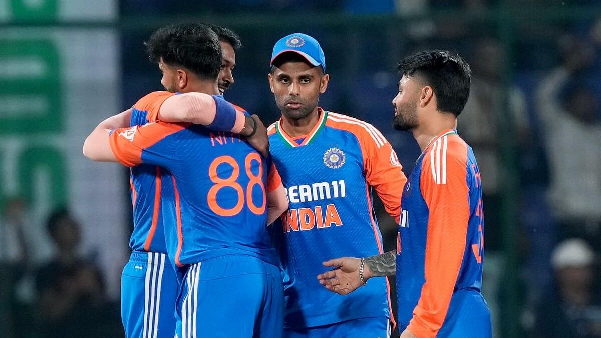 <div class="paragraphs"><p>Indian players celebrate after winning the second T20 International cricket match between India and Bangladesh at the Arun Jaitley Stadium, in New Delhi.</p></div>