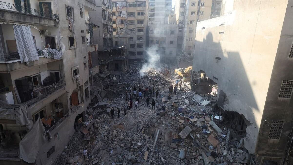 <div class="paragraphs"><p>People inspect the damage at the site of an Israeli strike, amid ongoing hostilities between Hezbollah and Israeli forces, in Beirut, Lebanon October 11, 2024. </p></div>