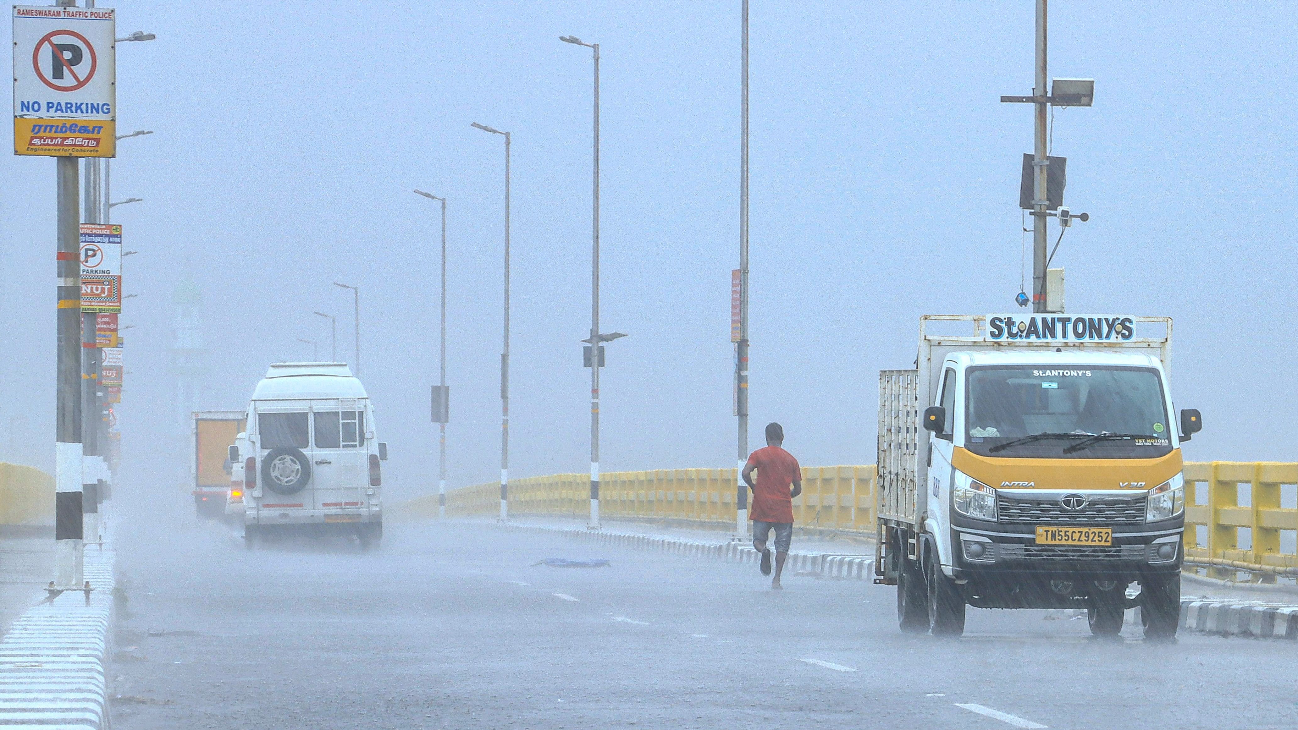 <div class="paragraphs"><p>Vehicles on the Pamban bridge amid rains in Rameswaram</p></div>