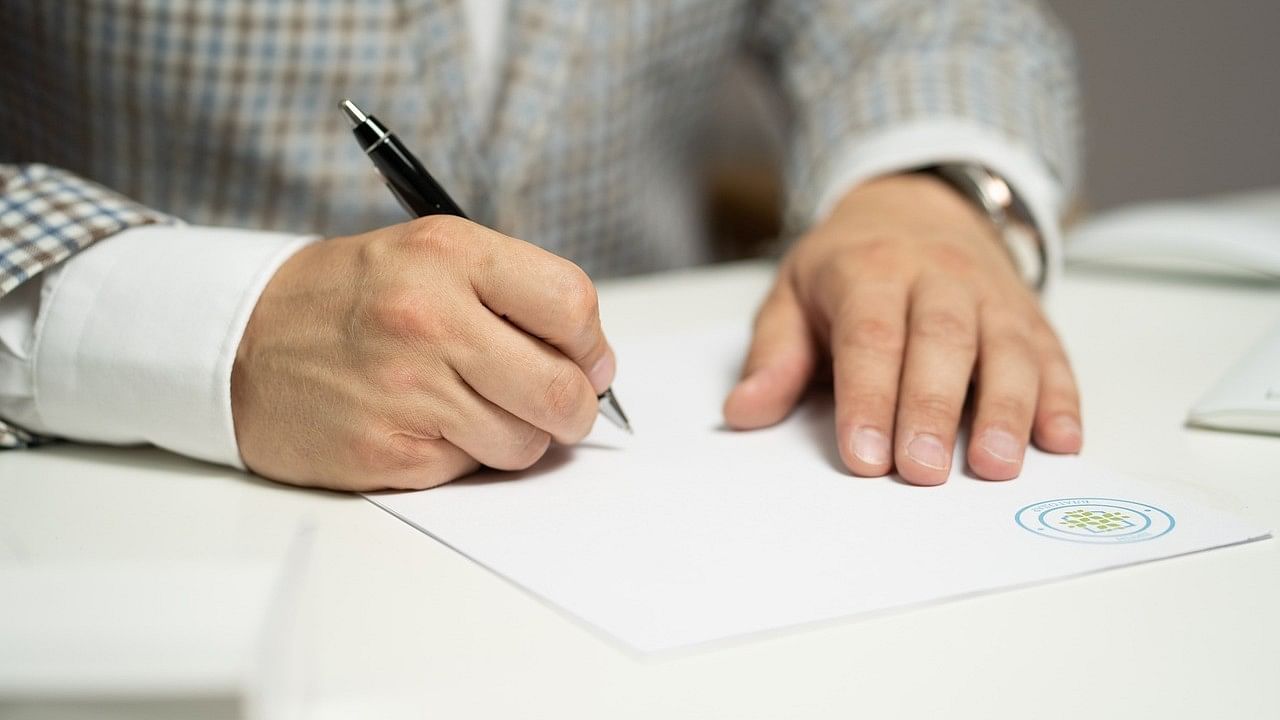 <div class="paragraphs"><p>Representative image showing an agreement being signed.</p></div>