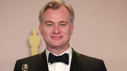 <div class="paragraphs"><p>Christopher Nolan poses with the Oscar for Best Picture and Best Director Oscar for <em>Oppenheimer</em>.</p></div>