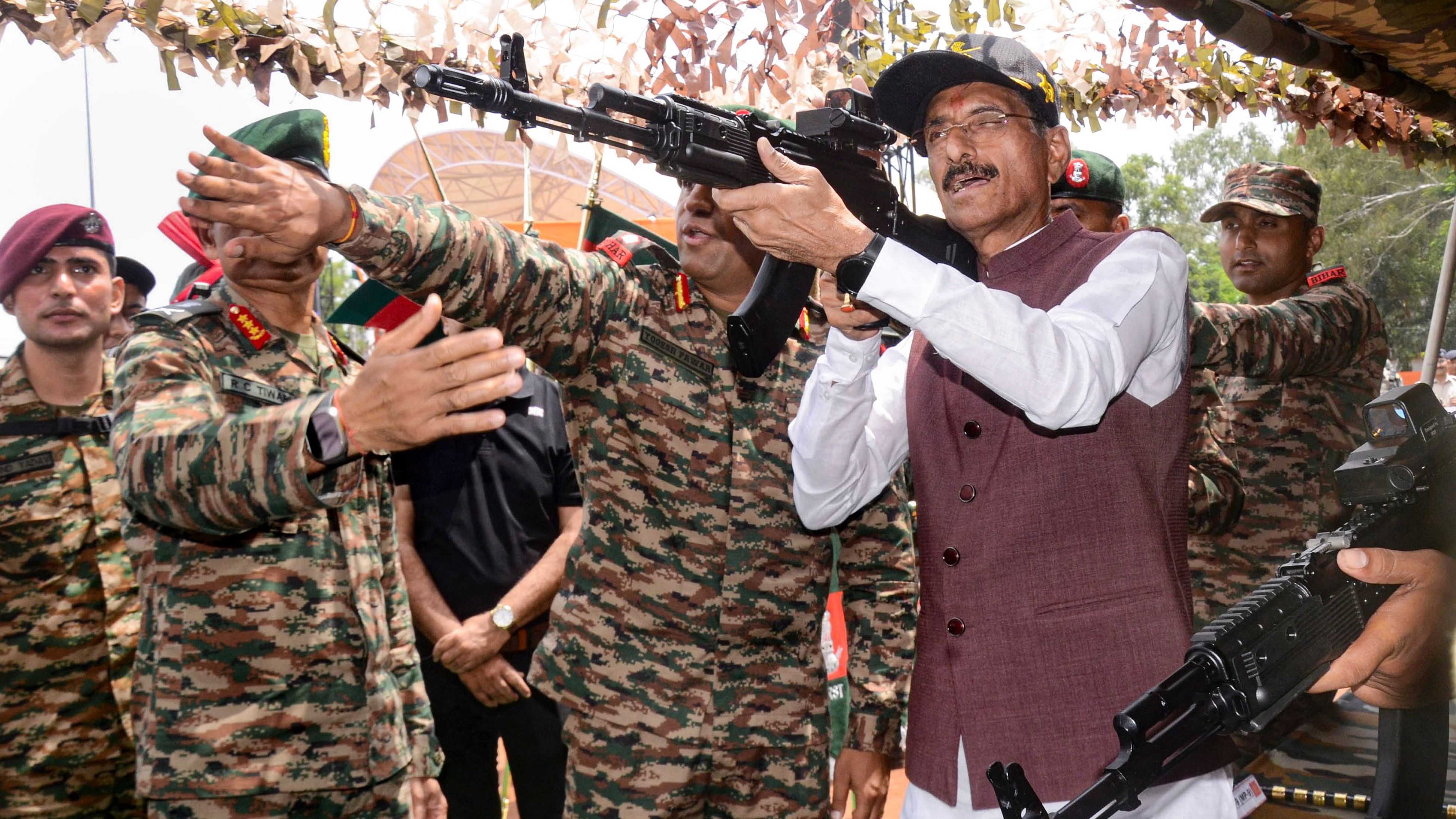 <div class="paragraphs"><p>Union Minister of State for Defence Sanjay Seth tries his hand on sophisticated SLR guns, during 'Know Your Army' programme, in Ranchi.</p></div>