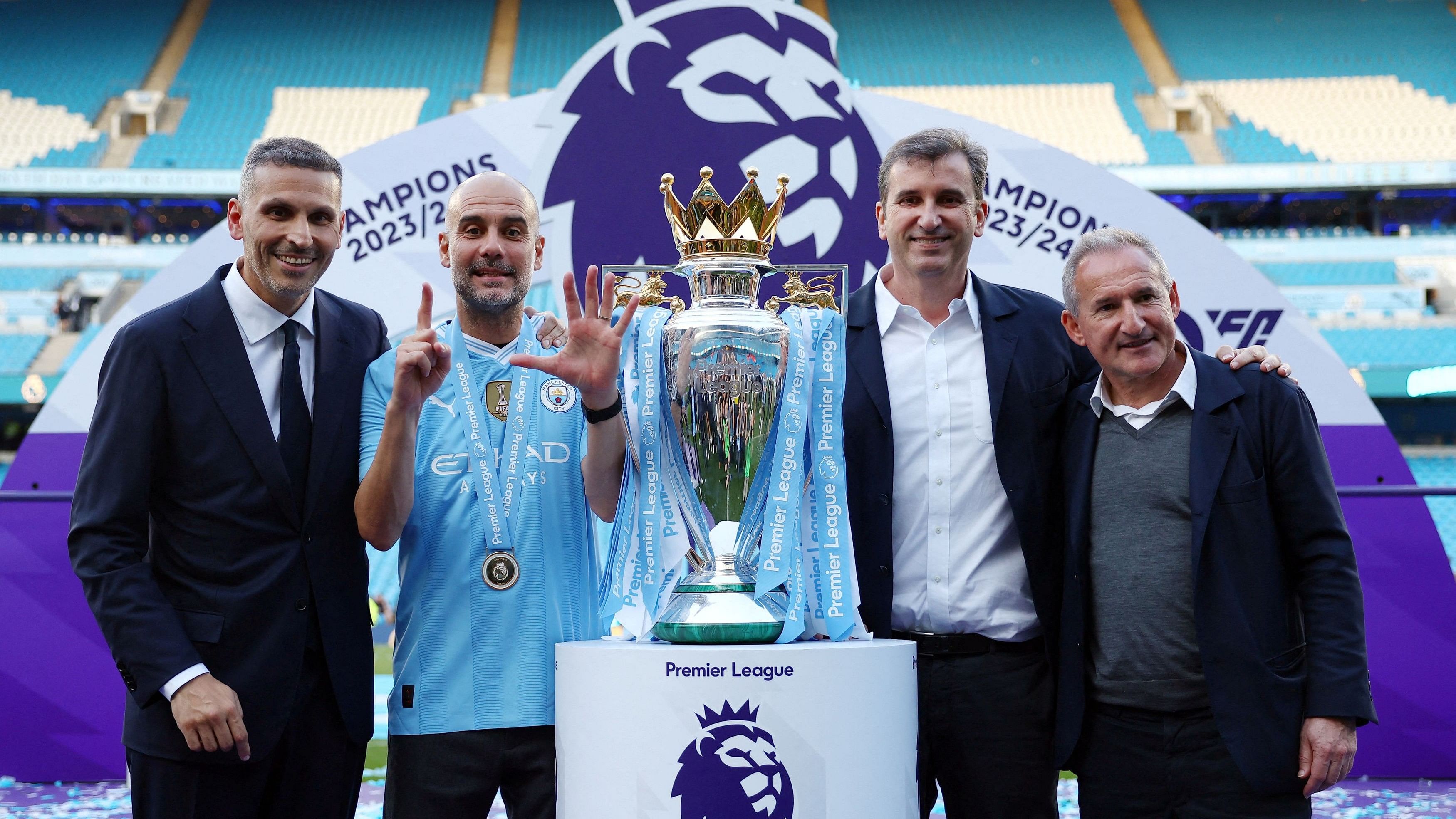 <div class="paragraphs"><p>Manchester City manager Pep Guardiola with chairman Khaldoon Al Mubarak, chief executive Ferran Soriano and director of football Txiki Begiristain celebrate with the trophy after winning the Premier League.</p></div>