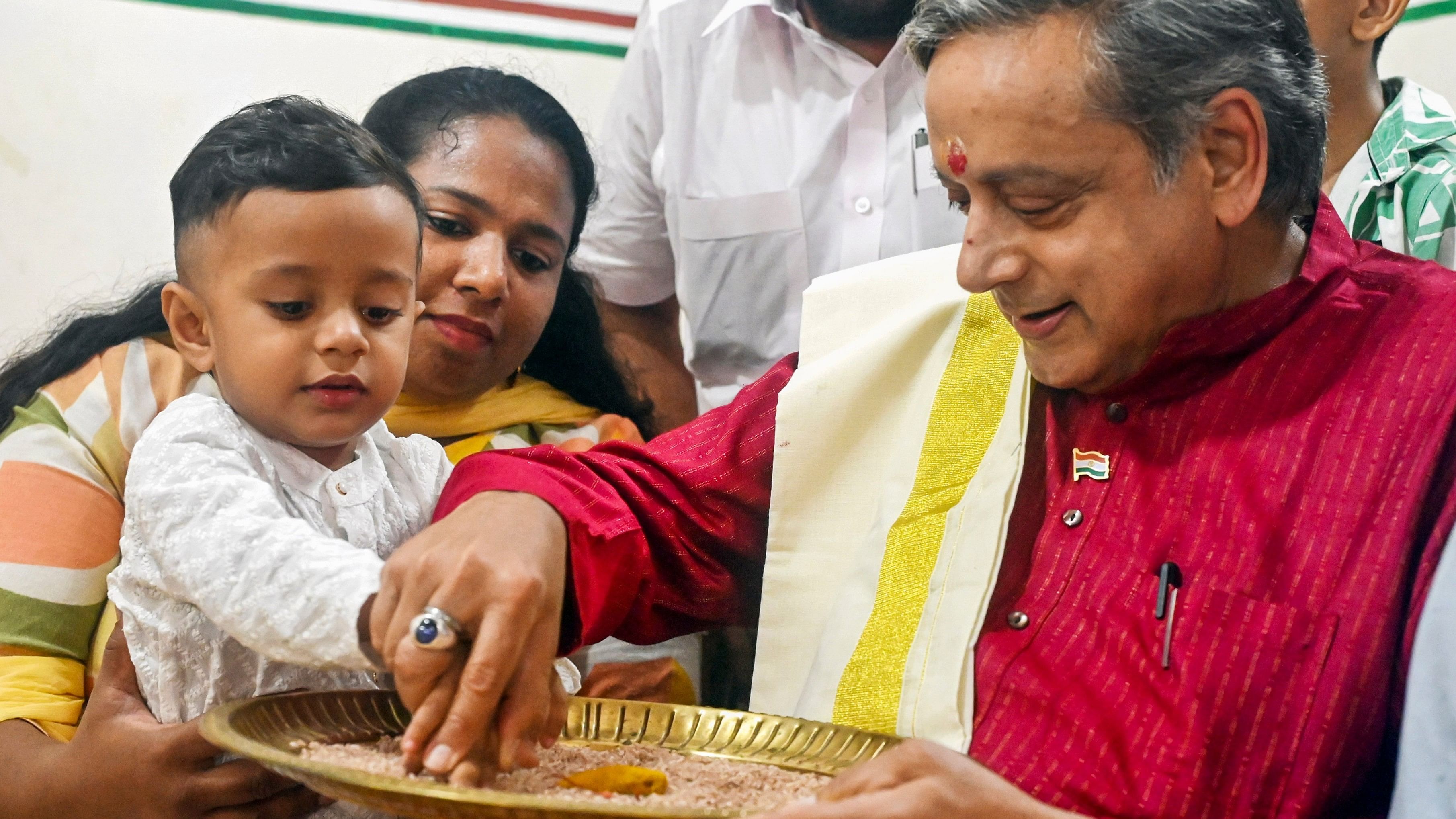 <div class="paragraphs"><p>Thiruvananthapuram: Senior Congress leader Shashi Tharoor initiates a child into the world of letters during the 'Vidyarambham' ceremony, in Thiruvananthapuram, Sunday, Oct. 13, 2024. </p></div>