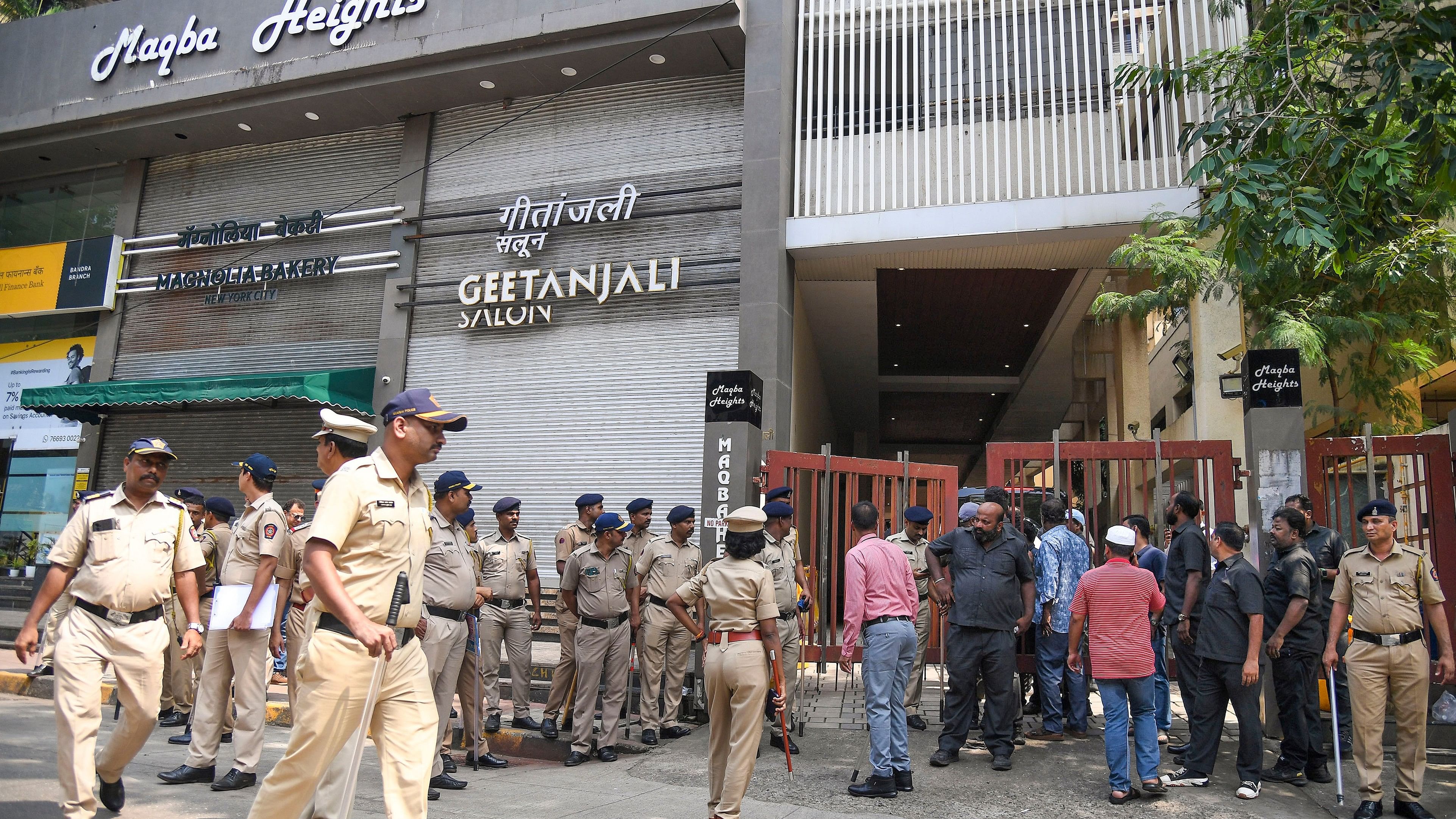 <div class="paragraphs"><p>Security personnel outside the residence of Baba Siddique in Mumbai, Sunday, Oct. 13, 2024. </p></div>