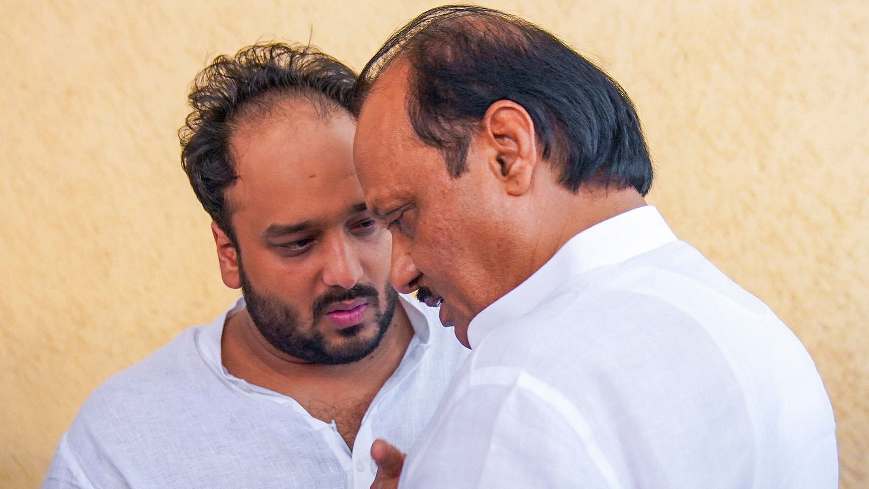 <div class="paragraphs"><p>Maharashtra Deputy Chief Minister and NCP leader Ajit Pawar with party leader Baba Siddique's son Zeeshan Siddique at Cooper Hospital, where the mortal remains of Baba Siddique were brought for postmortem, in Mumbai, Sunday, Oct. 13, 2024. Baba Siddique was shot dead by three assailants on Saturday.</p></div>