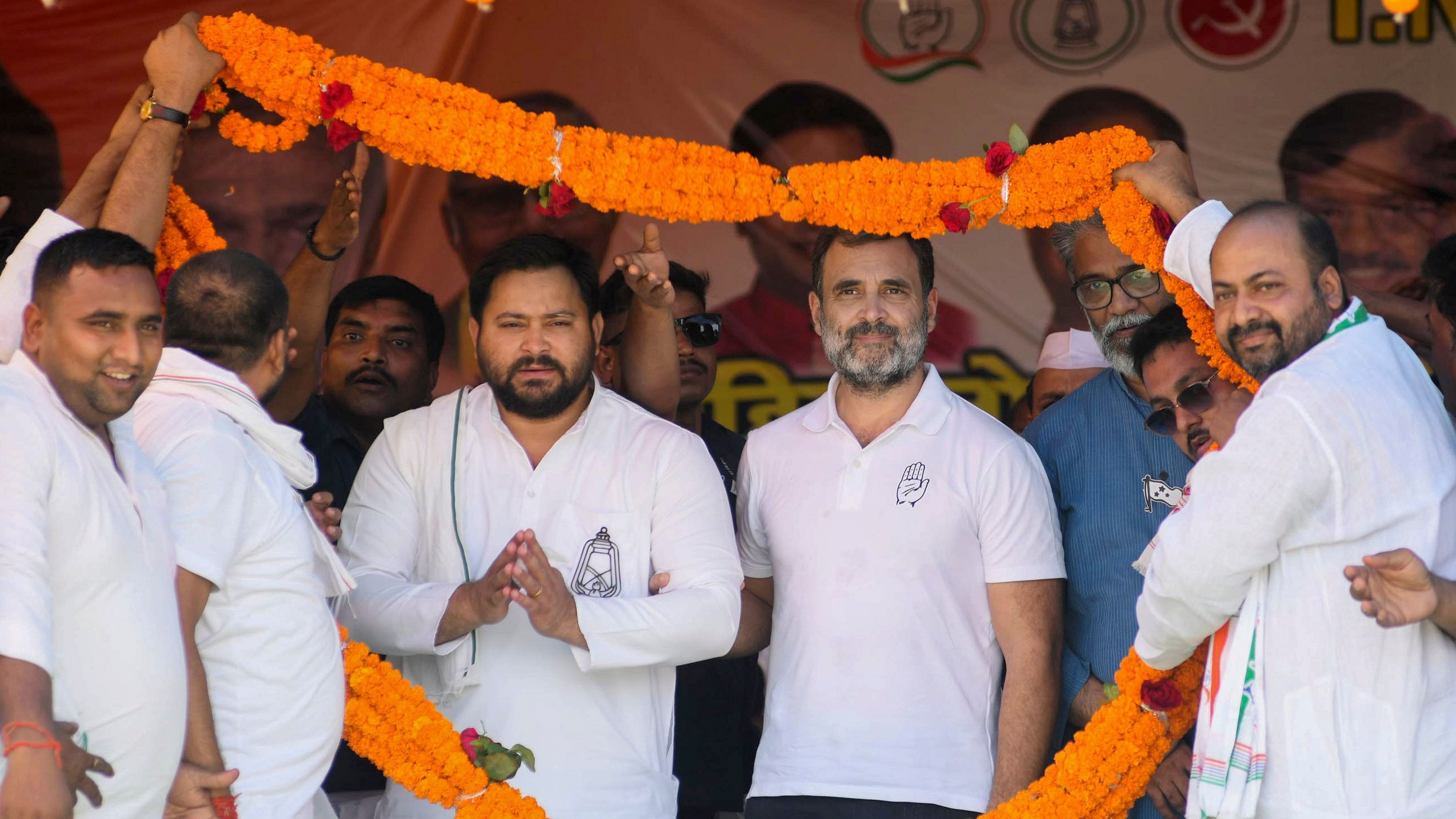 <div class="paragraphs"><p>File Photo: Congress leader Rahul Gandhi, RJD leader Tejashwi Yadav and CPI(ML) Liberation General Secretary Dipankar Bhattacharya being garlanded during a public meeting in favour of INDIA alliance (Congress) candidate Anshul Avijit for Lok Sabha polls, at Khusrupur, in Patna.</p></div>