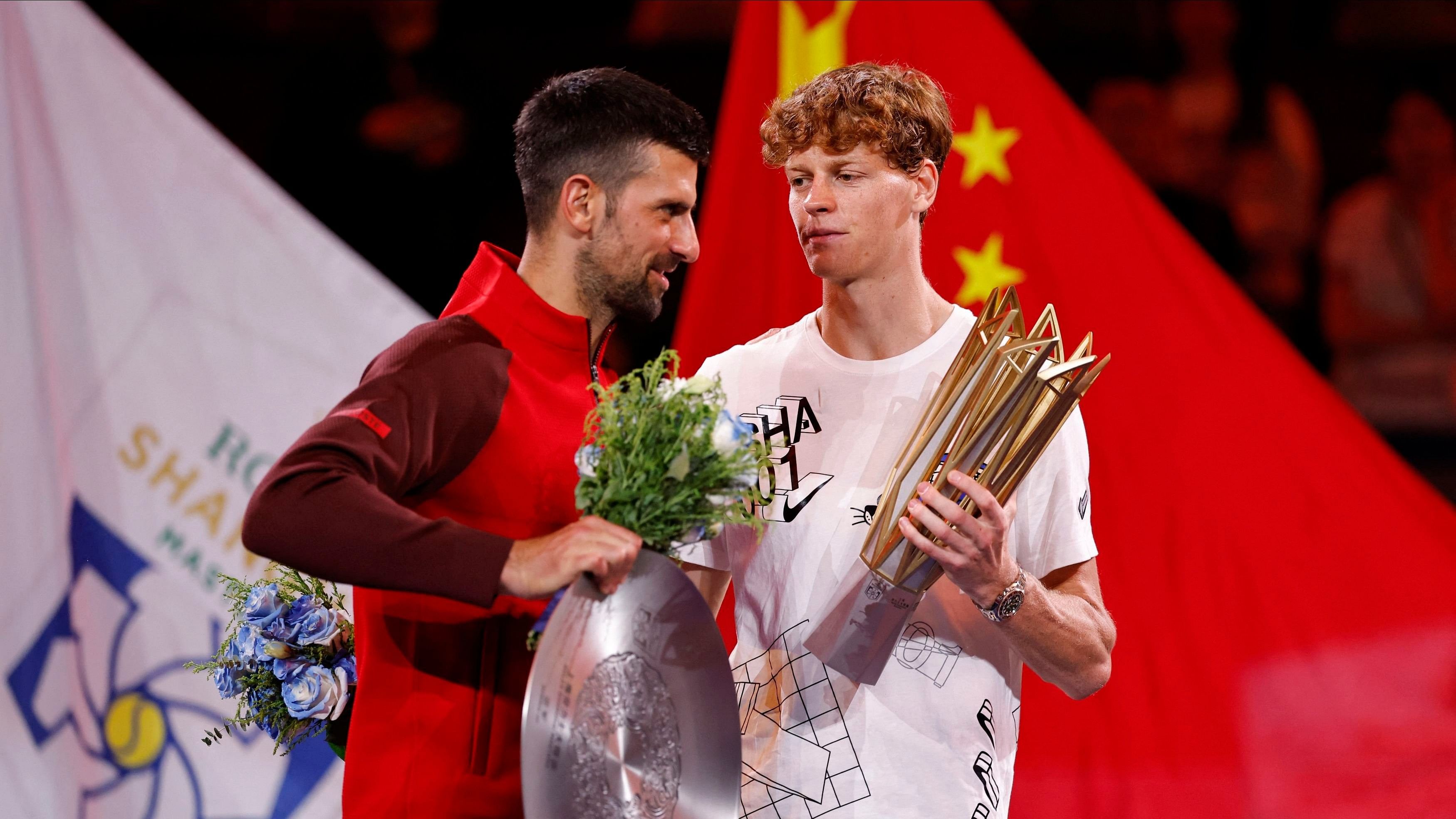 <div class="paragraphs"><p>Tennis - Shanghai Masters - Qizhong Forest Sports City Arena, Shanghai, China - October 13, 2024 Italy's Jannik Sinner celebrates with the trophy after winning his final match as Serbia's Novak Djokovic poses with the runners-up trophy.</p></div>