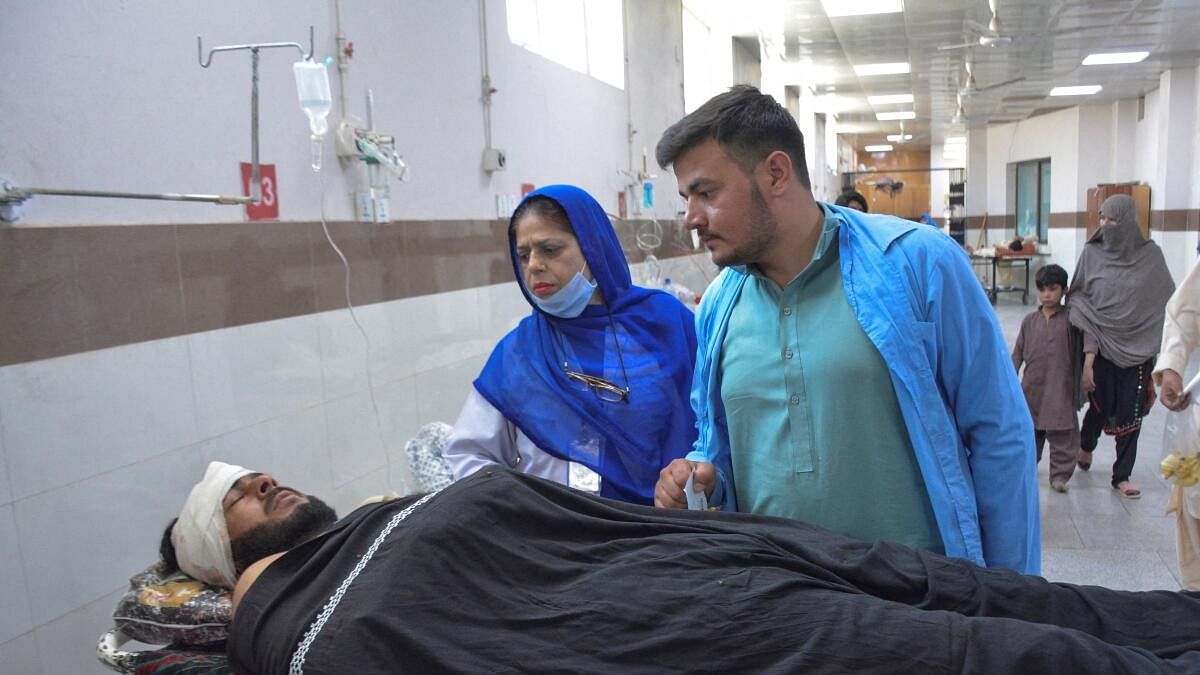 <div class="paragraphs"><p>A labourer, who along with others was injured after gunmen attacked a cluster of small private coal mines, receives medical assistance in the Trauma Centre at the Civil Hospital in Quetta.</p></div>