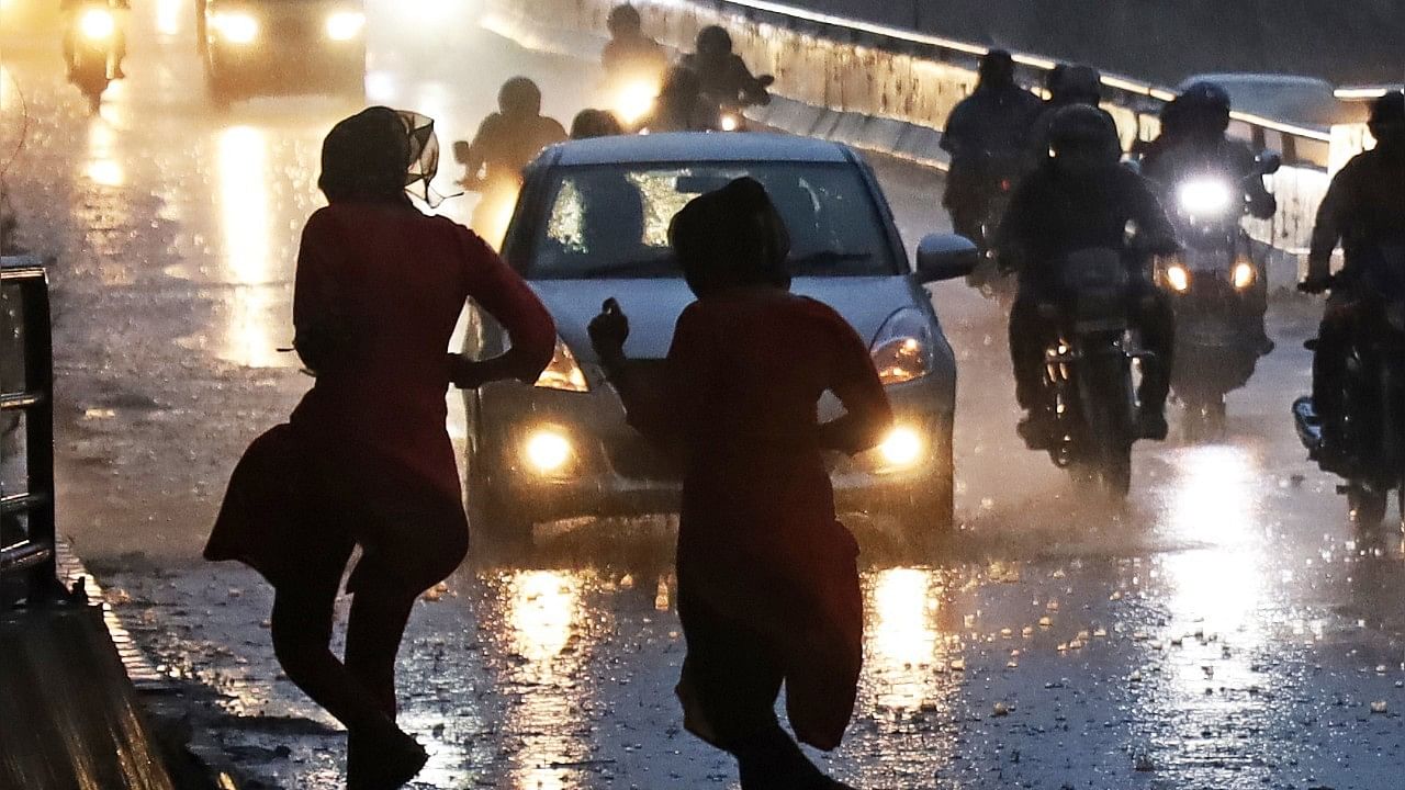 <div class="paragraphs"><p>Representative image showing people caught in the rain. </p></div>