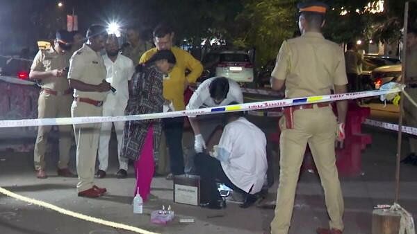 <div class="paragraphs"><p>Forensic team investigates at the site where former Maharashtra minister Baba Siddique was shot dead by three assailants, in Mumbai, Saturday night.&nbsp;</p></div>