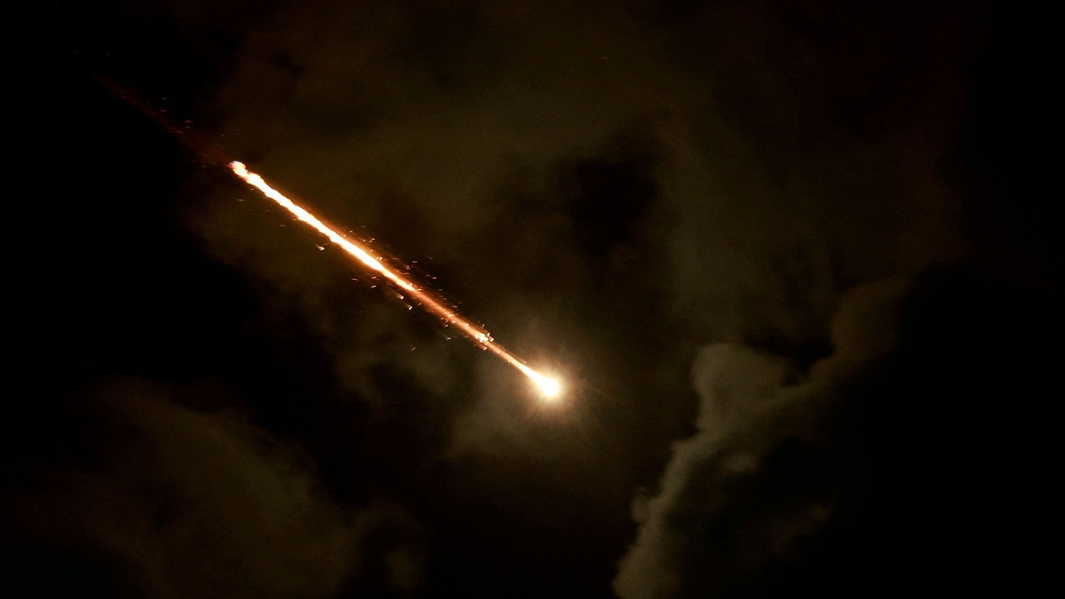 <div class="paragraphs"><p>A projectile is seen in the sky after Iran fired a salvo of ballistic missiles, amid cross-border hostilities between Hezbollah and Israel, as seen from Tel Aviv, Israel.</p></div>