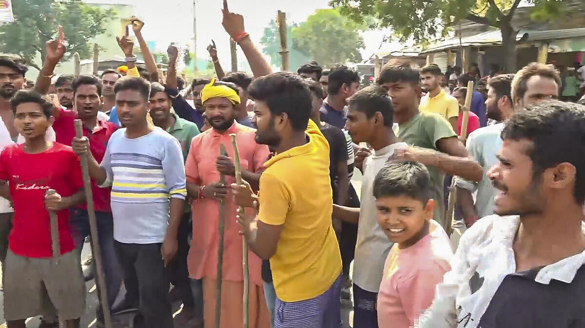 <div class="paragraphs"><p>People protest following Sunday night violence during goddess Durga idol immersion, in Bahraich, Monday, October 14, 2024.</p></div>