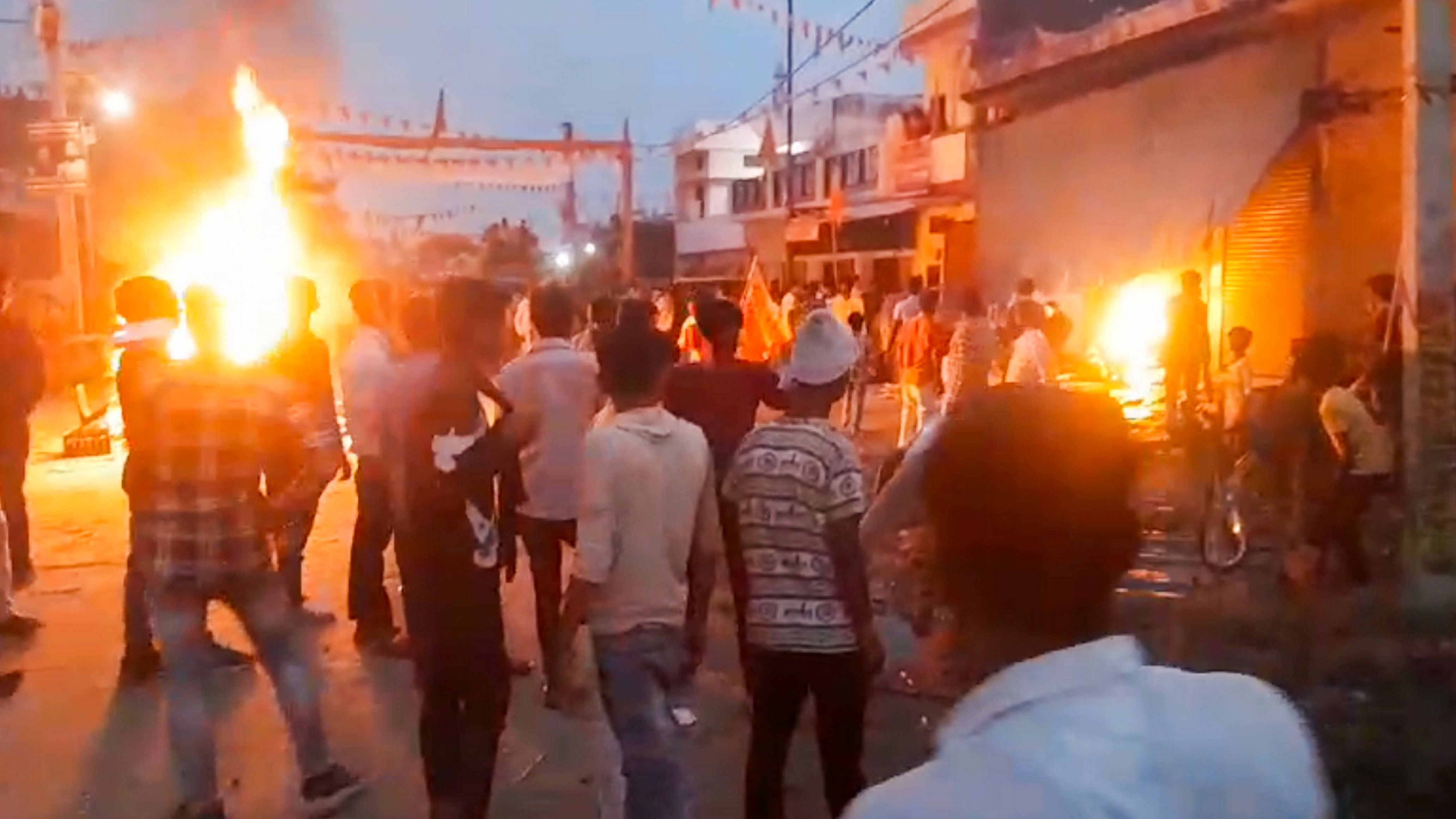 <div class="paragraphs"><p>People set fire to two-wheelers after a youth died of a gunshot wound during a religious procession at Mahrajganj Bazar in Bahraich on Sunday.</p></div>