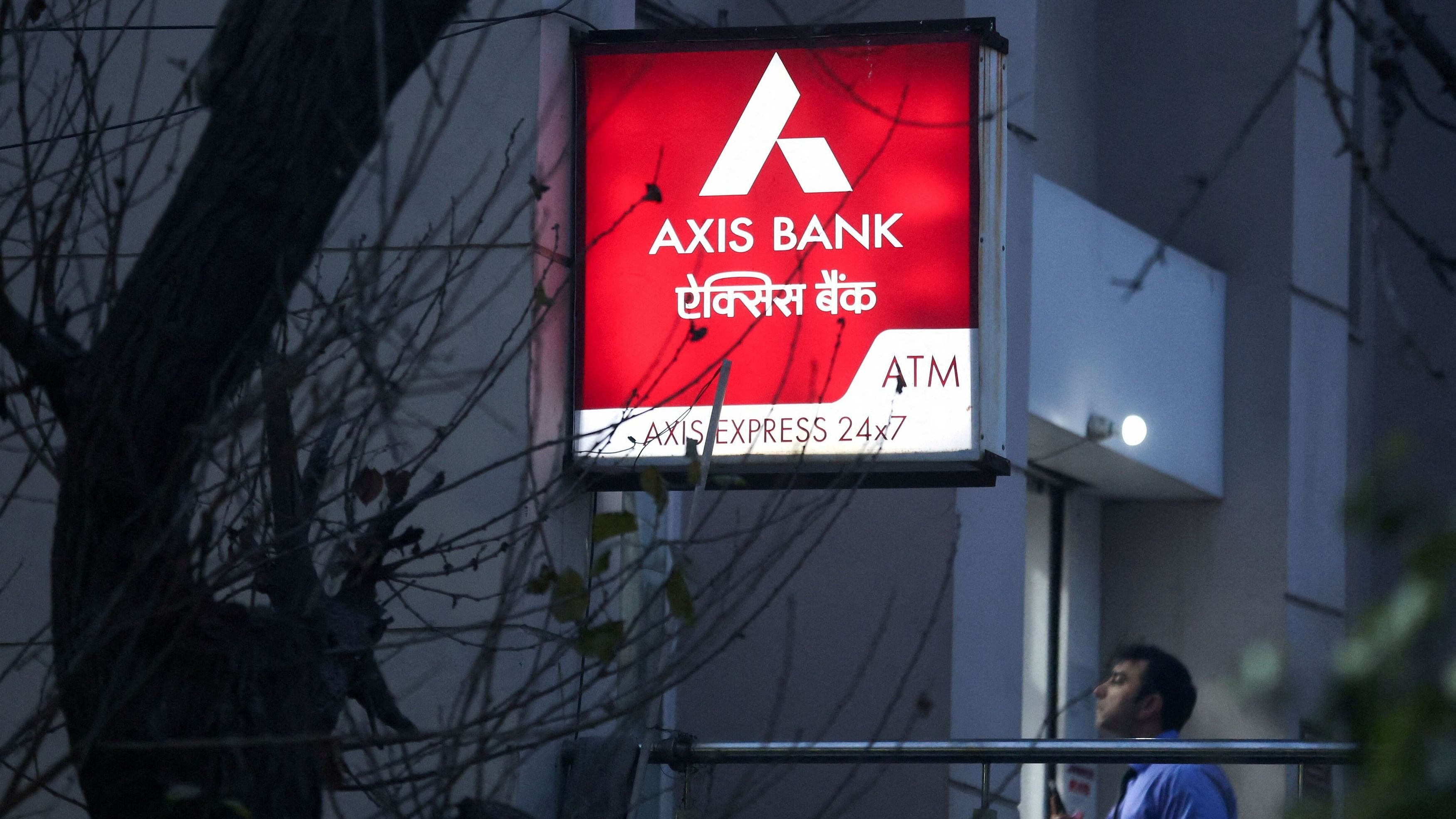 <div class="paragraphs"><p>A man enters a branch of Axis Bank in New Delhi </p></div>