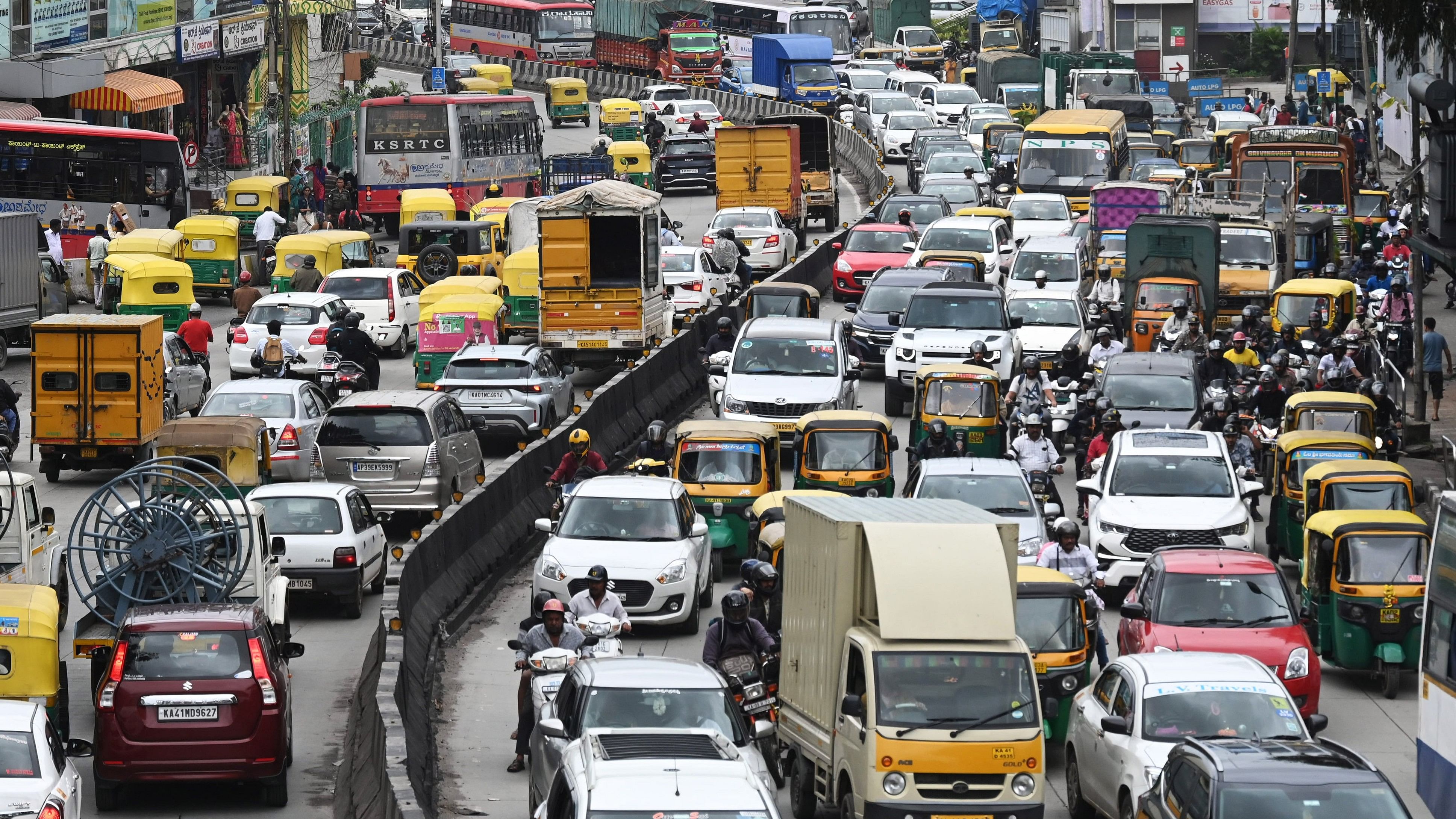 <div class="paragraphs"><p>Vehicles stuck on Mysuru Road near the Satellite Bus Stand on Monday. </p></div>