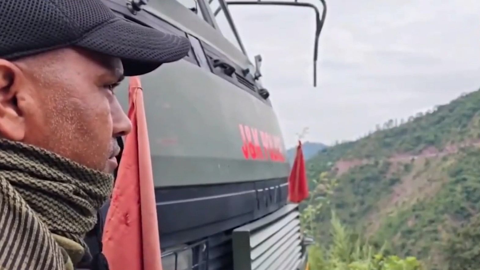 <div class="paragraphs"><p>A security official looks on during an anti-terrorist operation in J&amp;K's Rajouri. Screengrab taken from the operation video.</p></div>