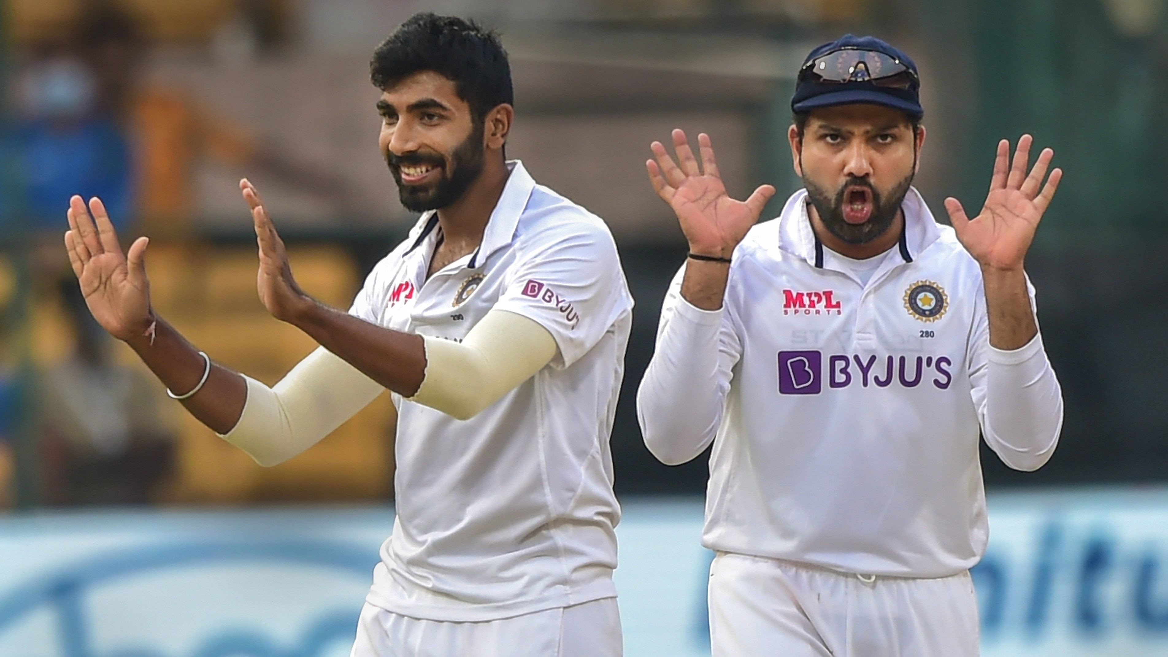 <div class="paragraphs"><p>Jasprit Bumrah with skipper Rohit Sharma celebrates the wicket</p></div>