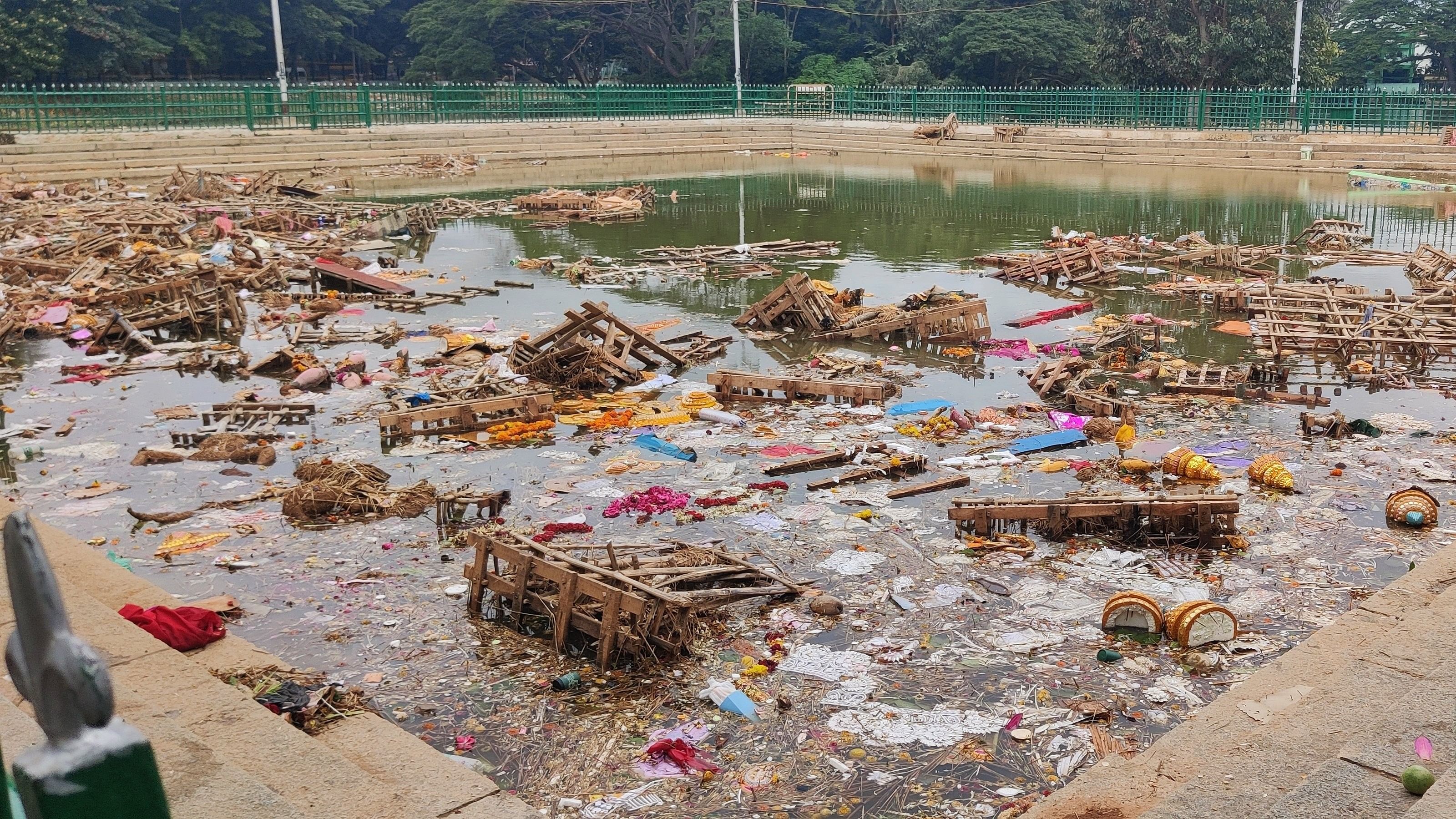 <div class="paragraphs"><p>Debris, idols and other festival items in the kalyani at Ulsoor Lake. Contractors say it will take two days to clean the kalyanis.</p></div>