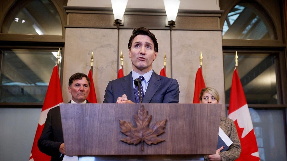 <div class="paragraphs"><p>Canada's Prime Minister Justin Trudeau, with Minister of Foreign Affairs Melanie Joly, and Minister of Public Safety, Democratic Institutions and Intergovernmental Affairs Dominic LeBlanc, takes part in a press conference about the Royal Canadian Mounted Police's investigation into "violent criminal activity in Canada with connections to India", on Parliament Hill in Ottawa, Ontario, Canada October 14, 2024.</p></div>