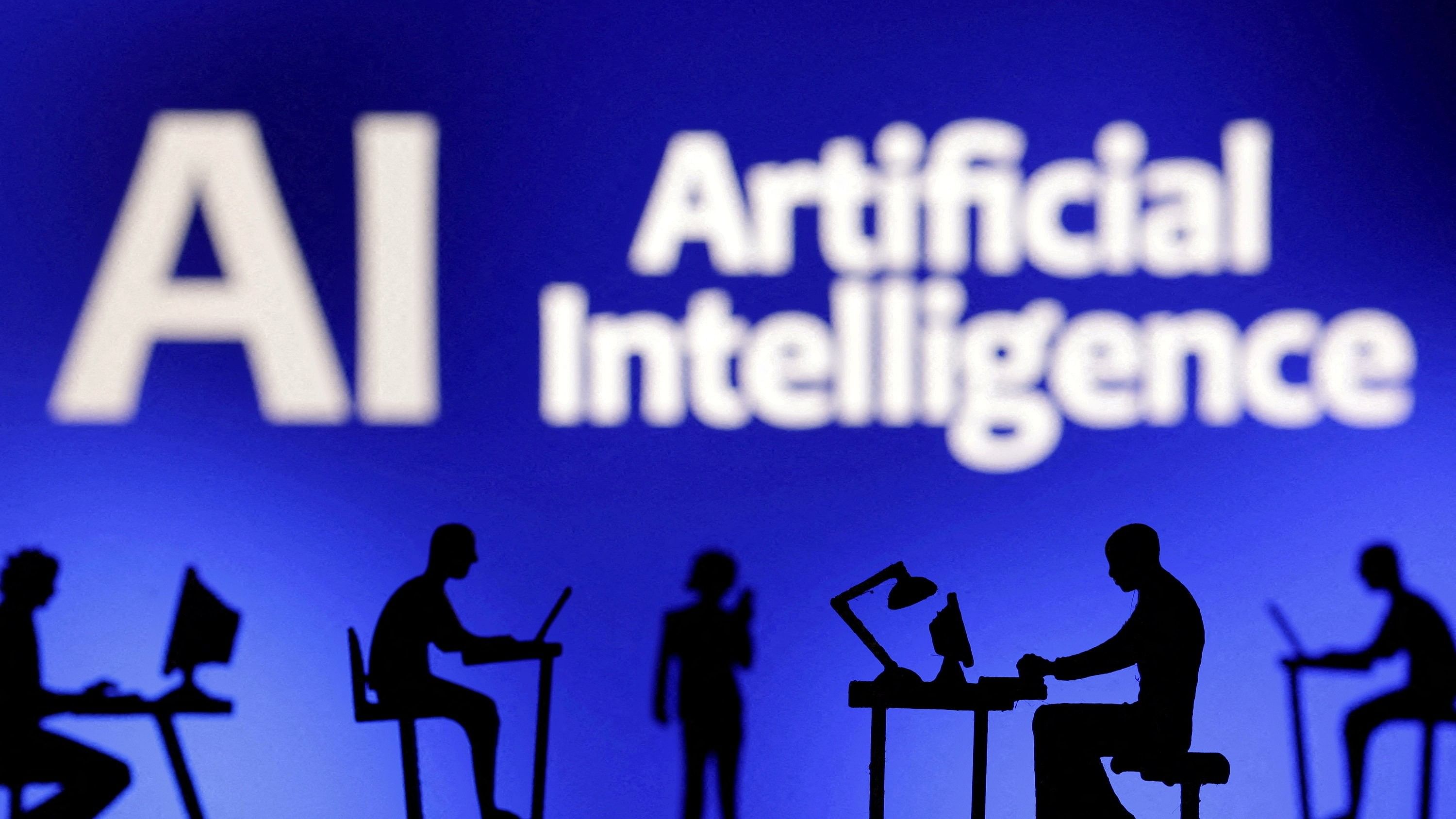 <div class="paragraphs"><p>Figurines with computers and smartphones are seen in front of the words 'Artificial Intelligence AI' in this illustration.</p></div>