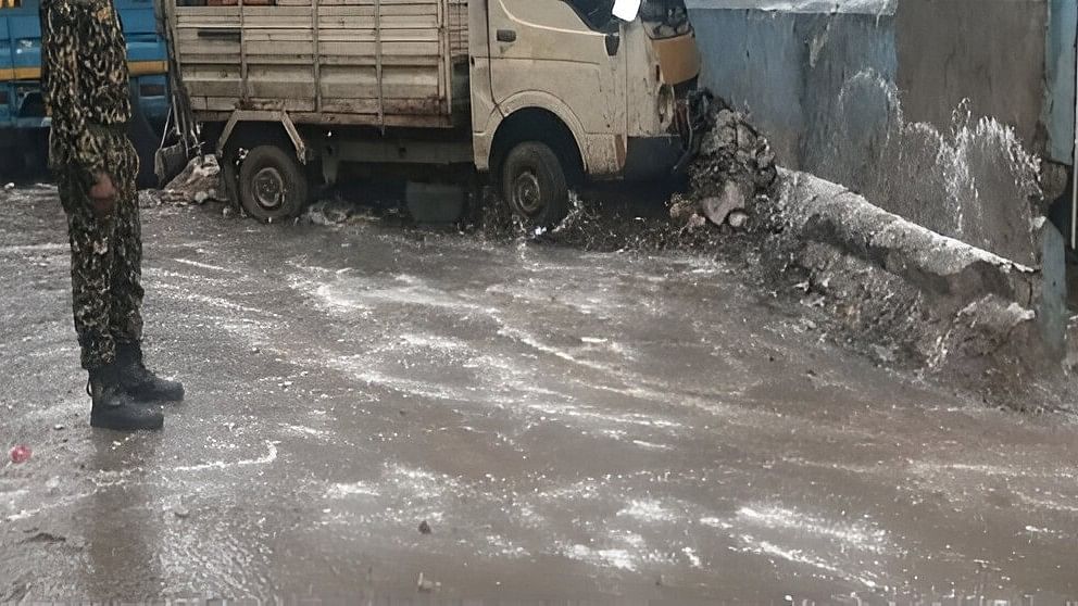 <div class="paragraphs"><p>Civic workers sanitise M Rama Rao Road-SJP Road Cross on Monday. </p></div>