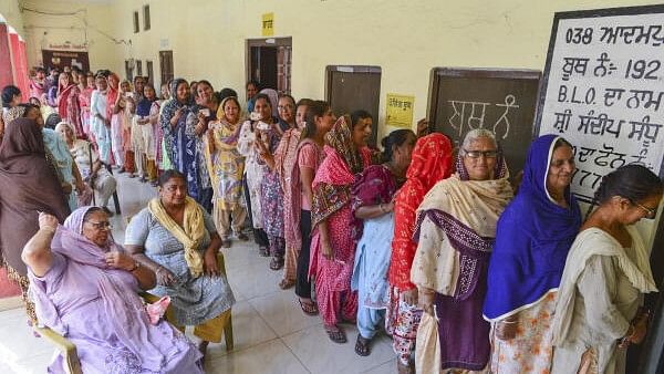 <div class="paragraphs"><p>Women wait to cast their votes for the Punjab gram panchayat elections, in Jalandhar.</p></div>